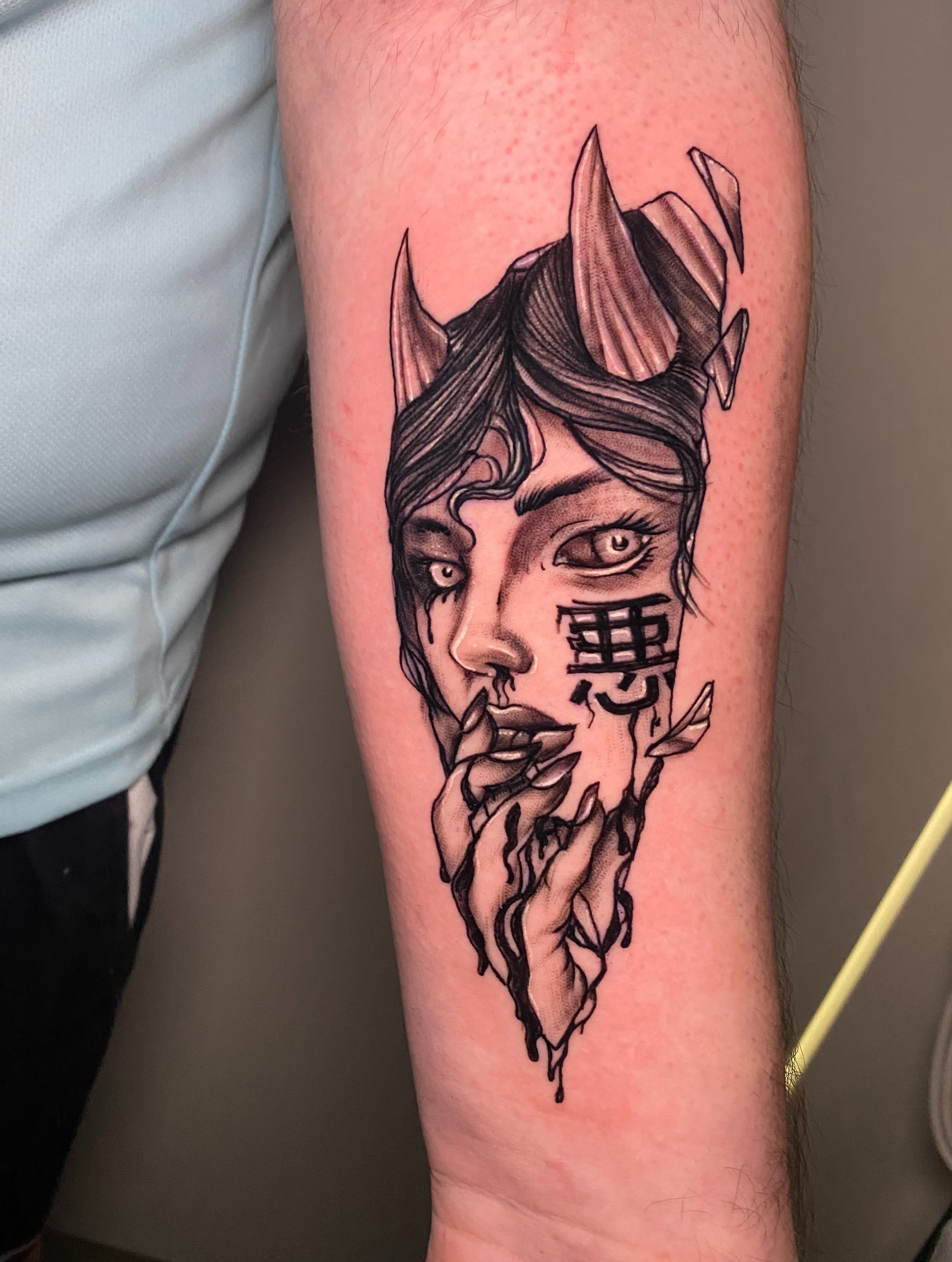 Woman with horns black and grey tattoo on the forearm by @dom_macio_tattoo