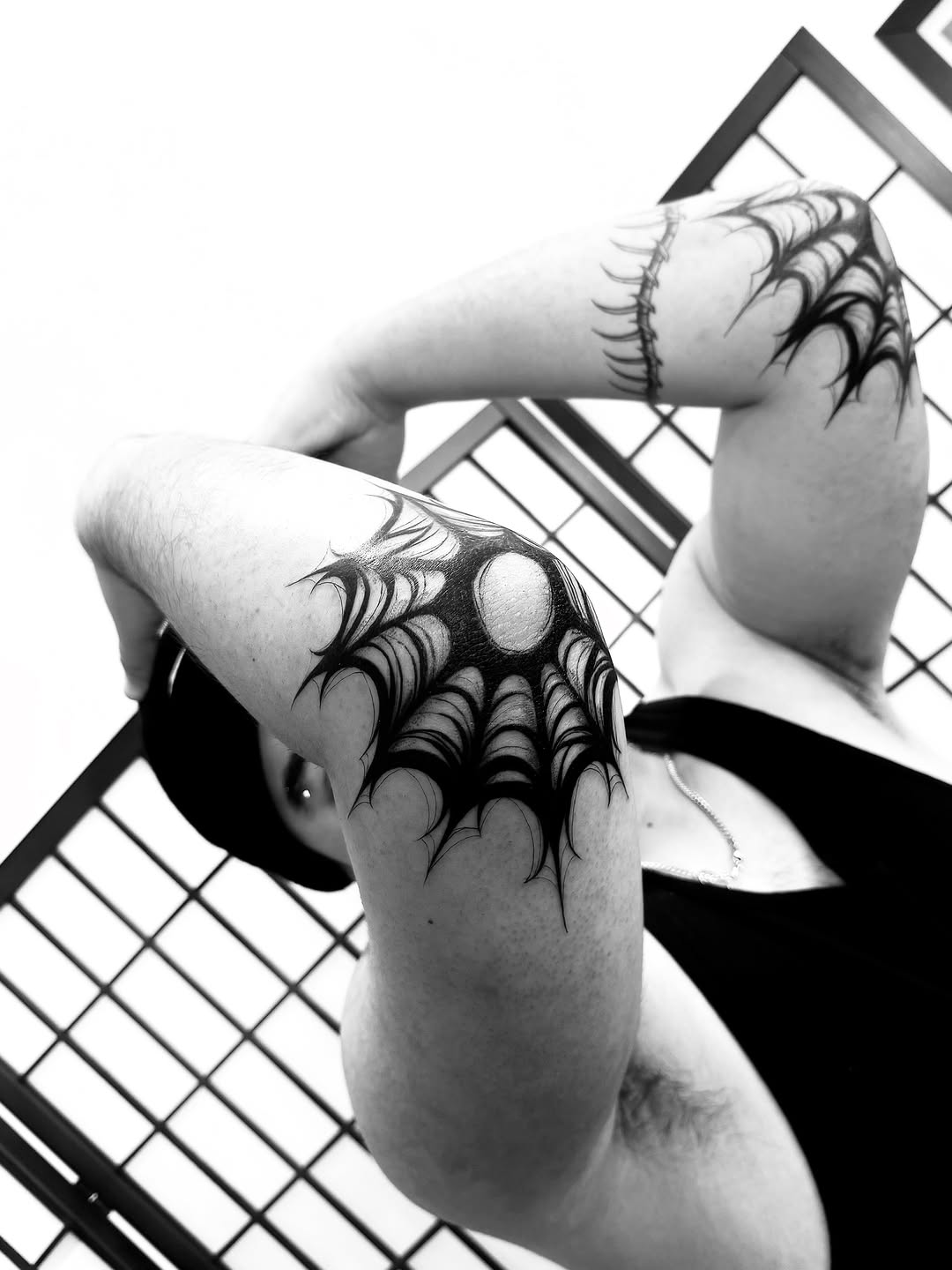 Spider web blackwork tattoo on the upper arm by MISO ⟡ Bay Area Tattoo Artist