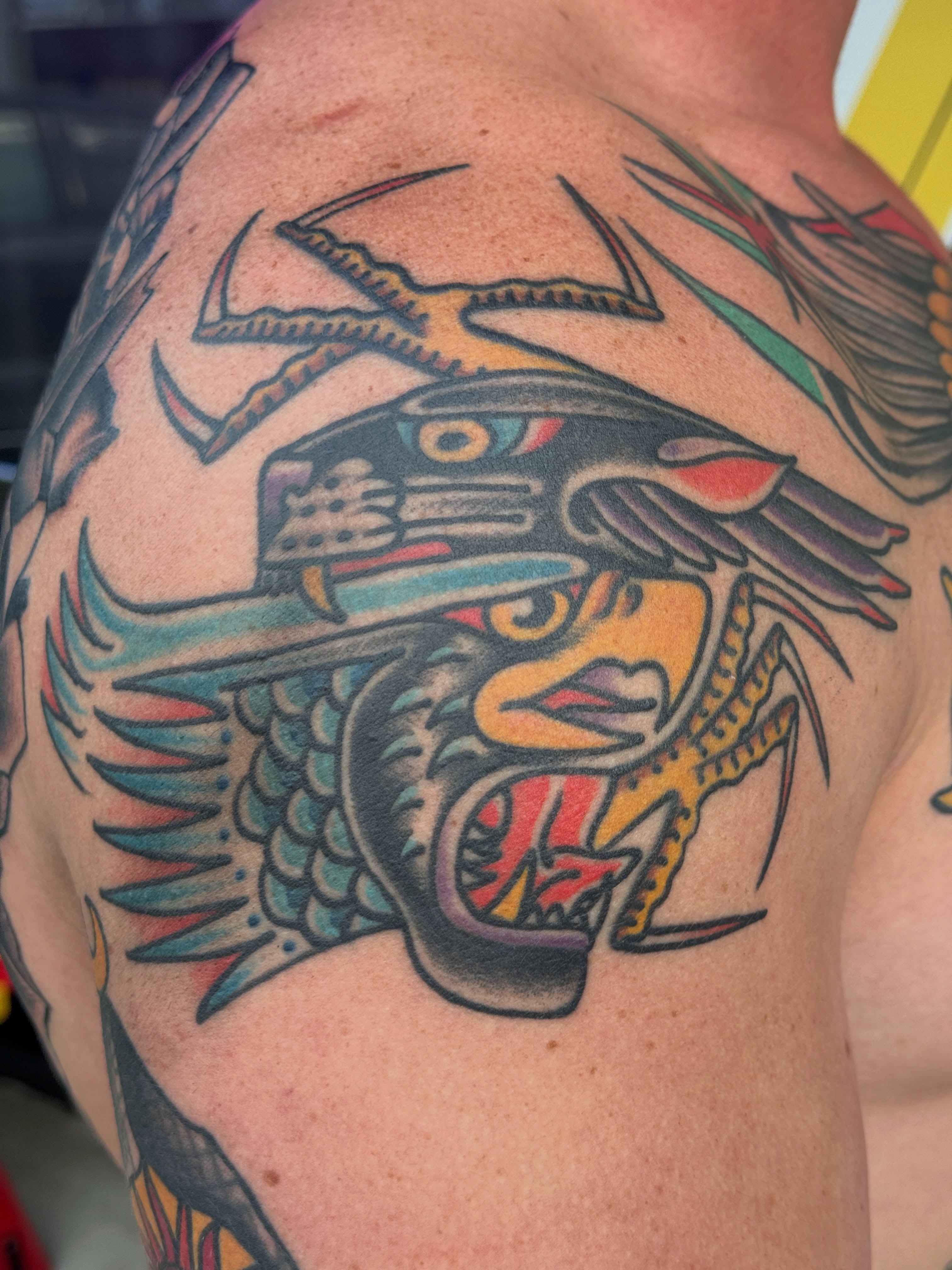 Hawk American traditional tattoo on the shoulder by Butch Mickle