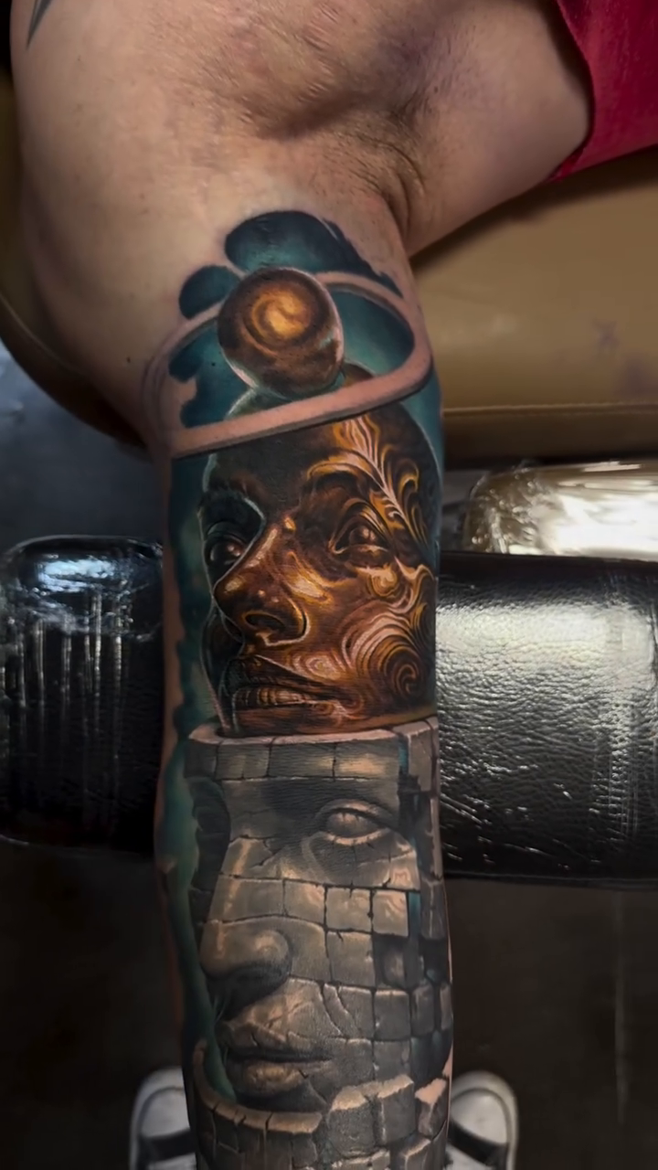 Two faces, one stone, one golden realism tattoo by Jacob Sheffield, Grand Junction, Colorado