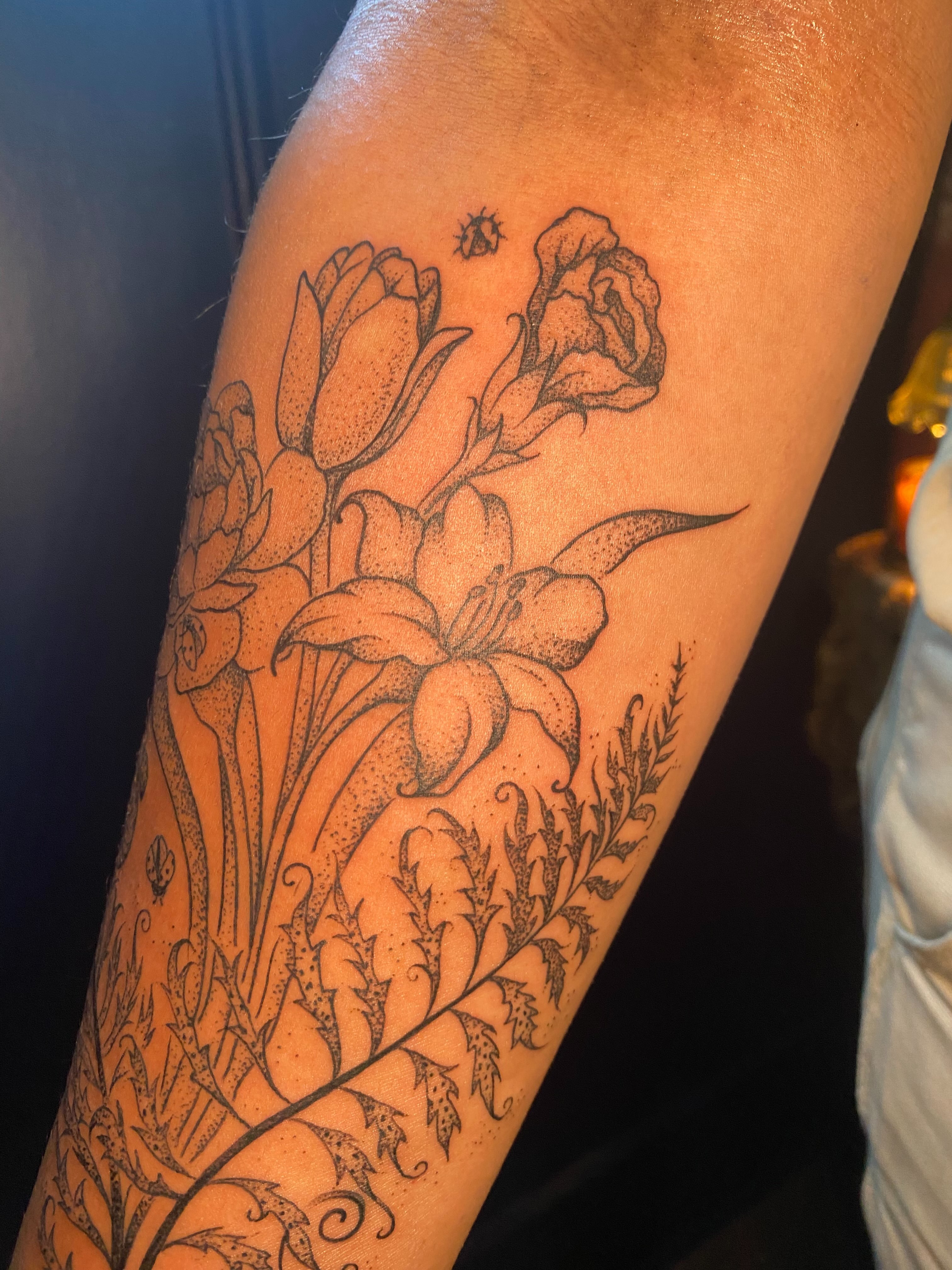 Floral arrangement dotwork tattoo on the forearm by Jesikah Rapp