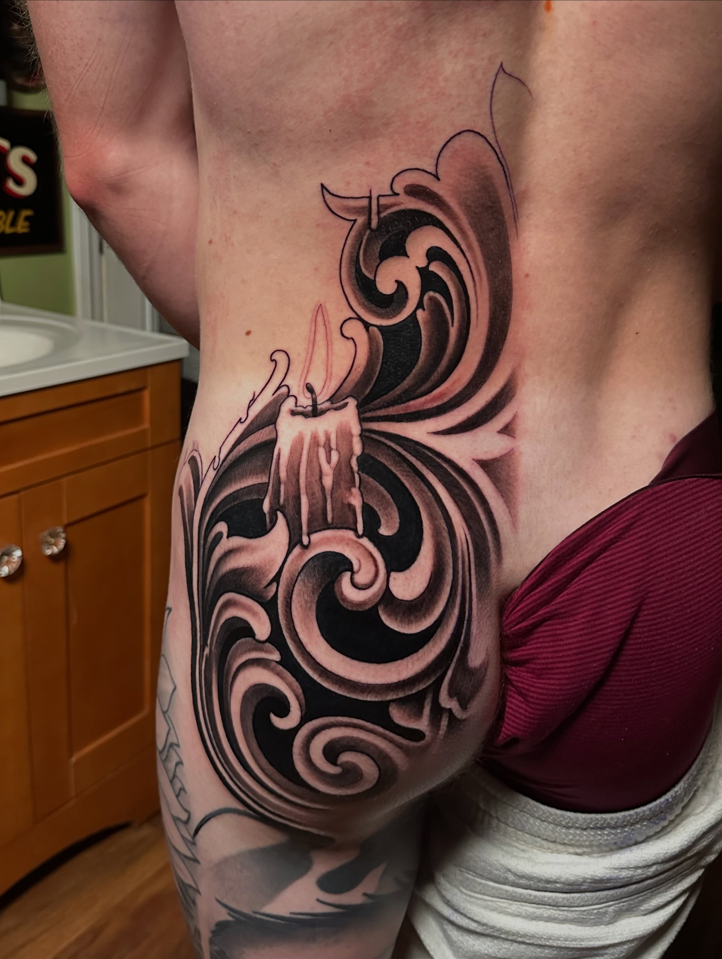 Candle and swirls ornamental tattoo by Trevor Burtz