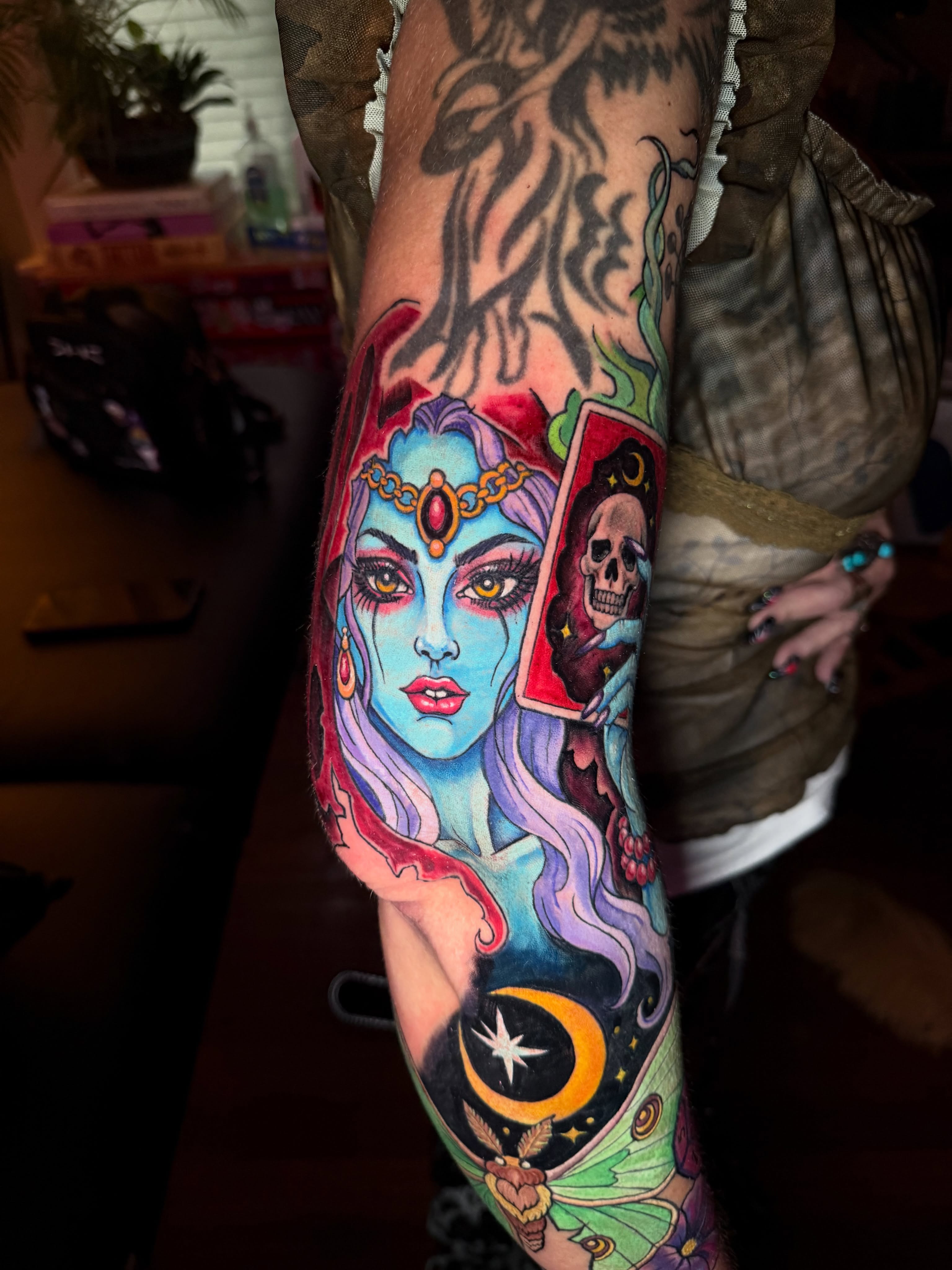 Woman with tarot card American traditional tattoo on the forearm by Brandt Norcross