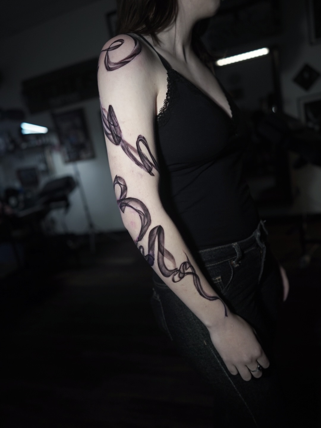 Abstract swirls black and grey tattoo on the upper arm by Niko Hosk Cataldo