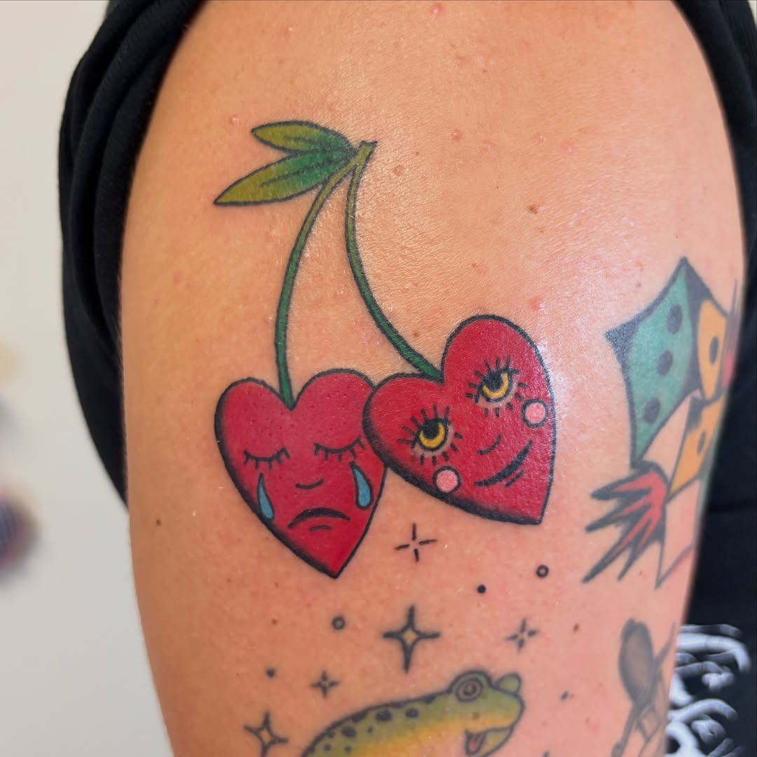 Cherry couple American traditional tattoo on the shoulder by Juliet Miller