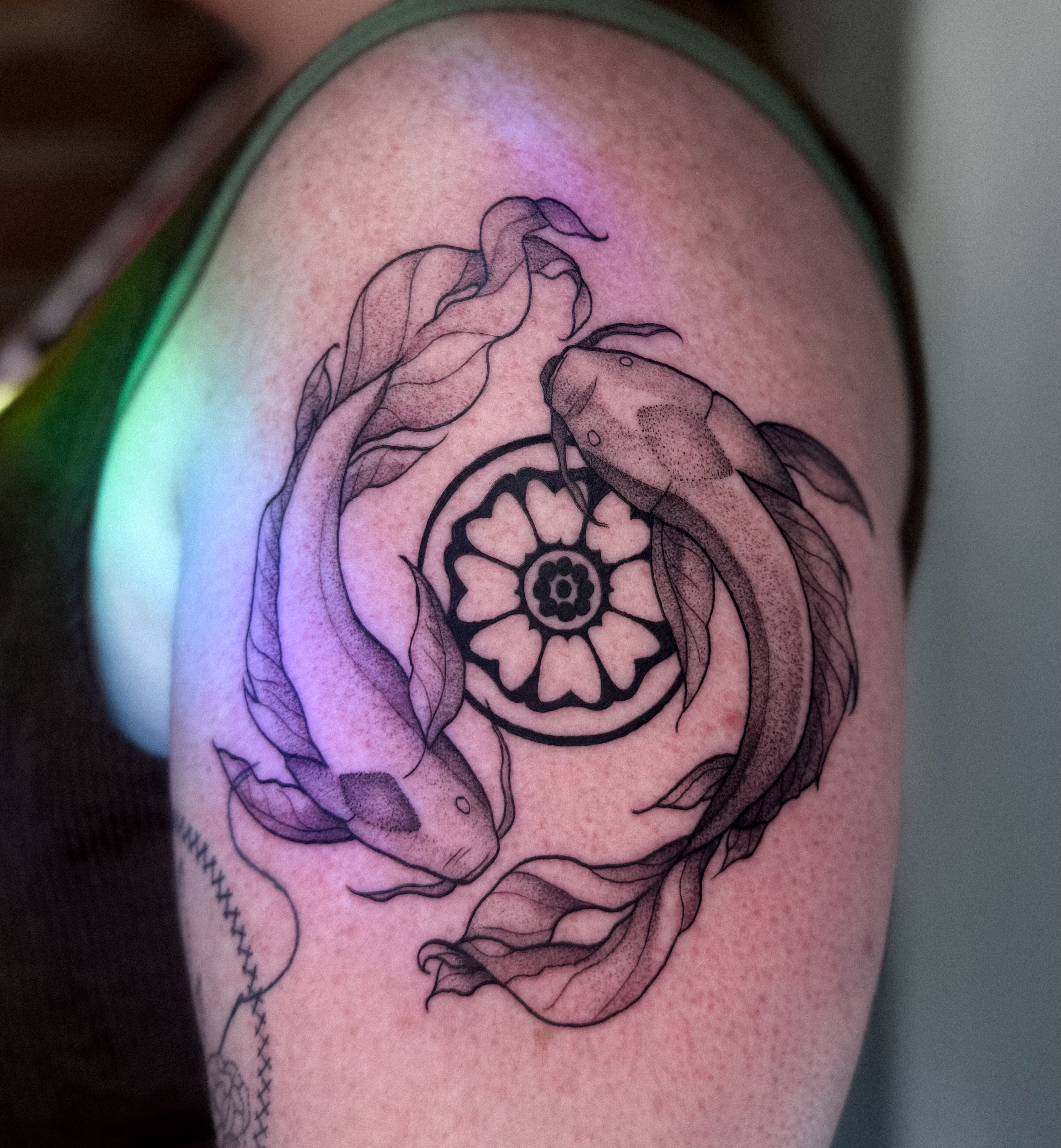 Koi fish and mandala geometric tattoo on the shoulder by Jessica Bloom