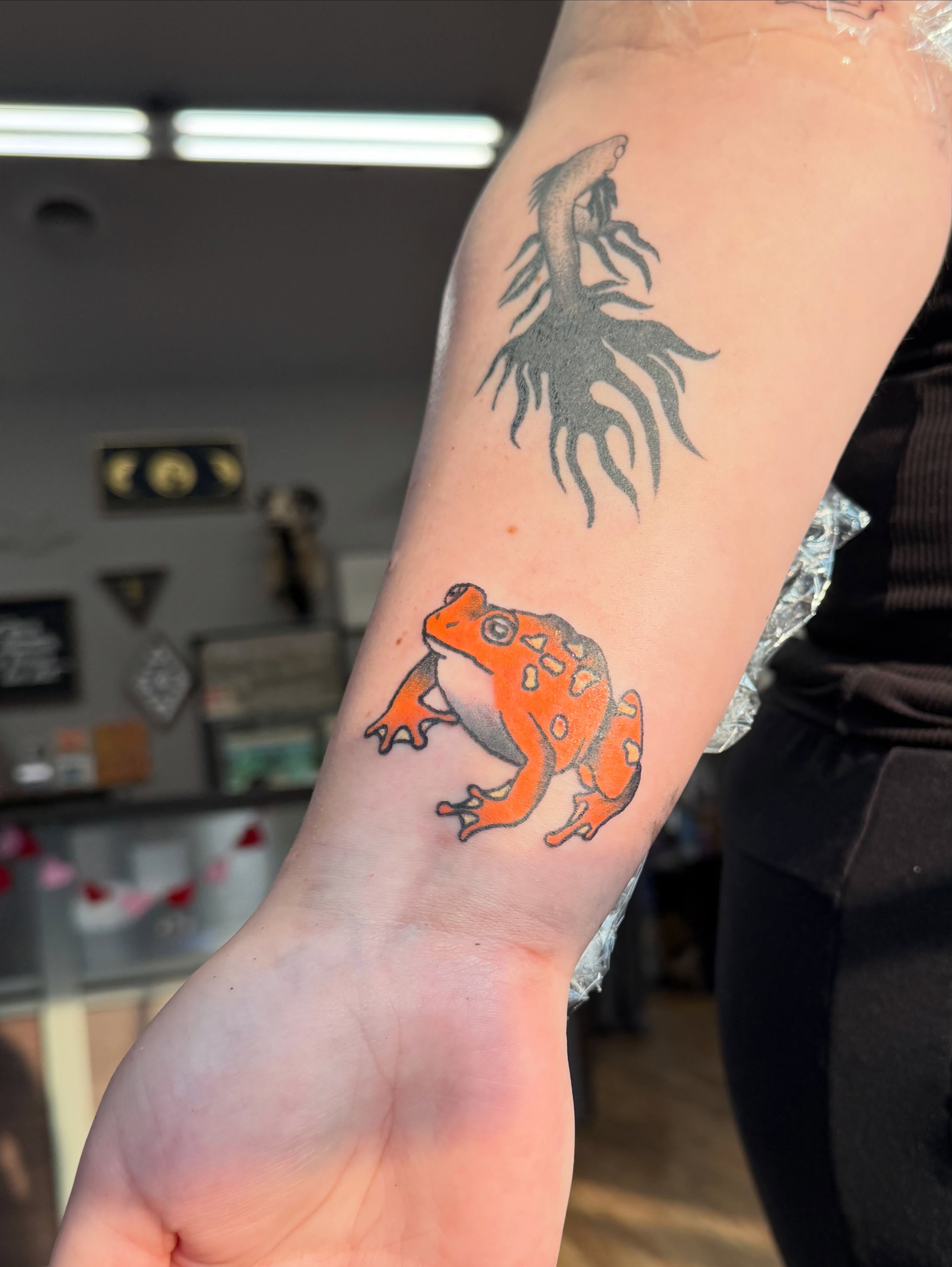 Frog realism tattoo on the forearm by Giana Masso
