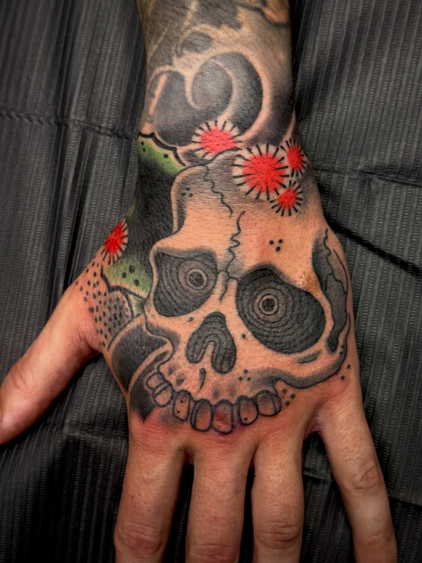 Skull dotwork tattoo on the hand by Jason Eisenberg