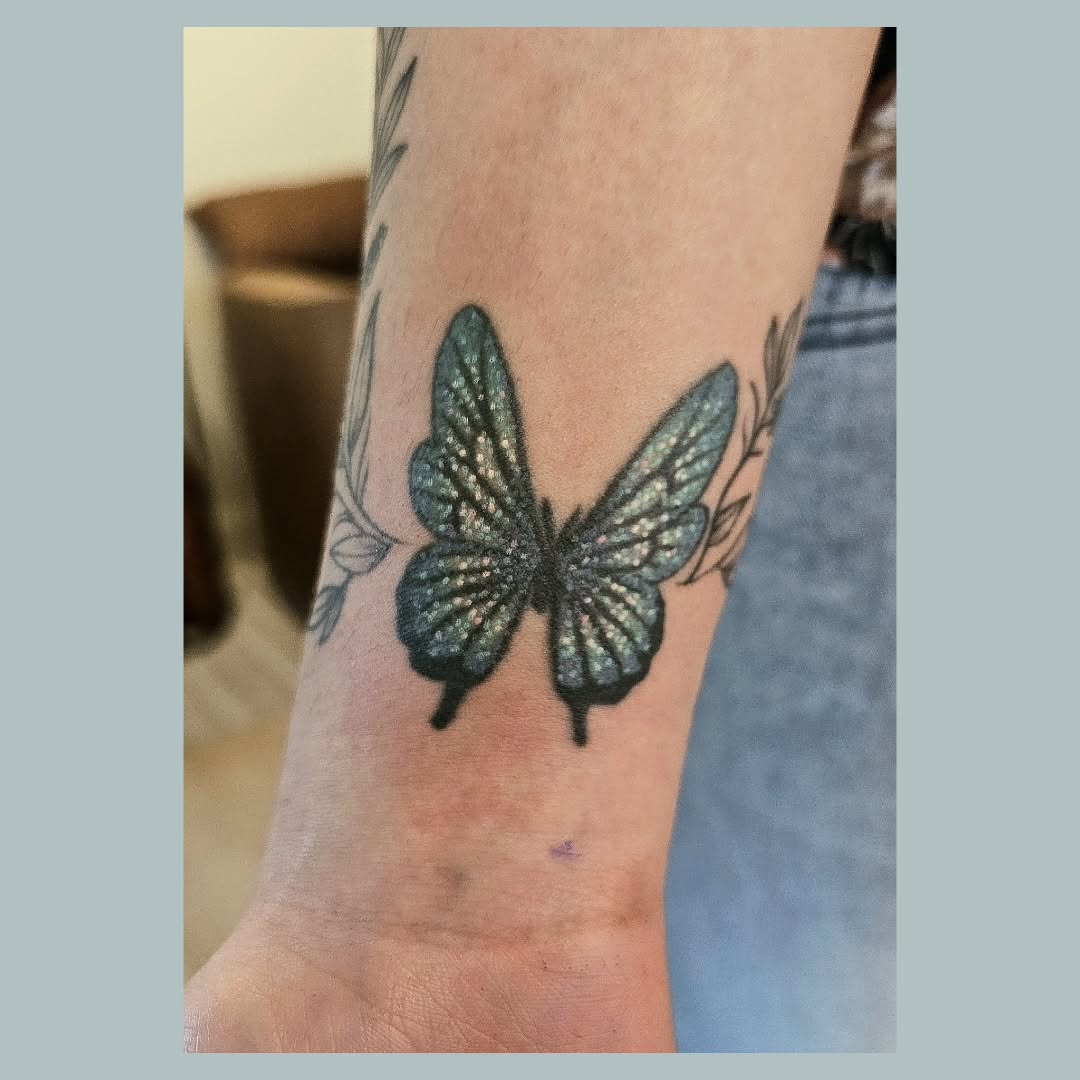Butterfly with leaves fine line tattoo on the forearm by The Fabled Tattooist (Alyssa Summers), Eagle Point, Oregon