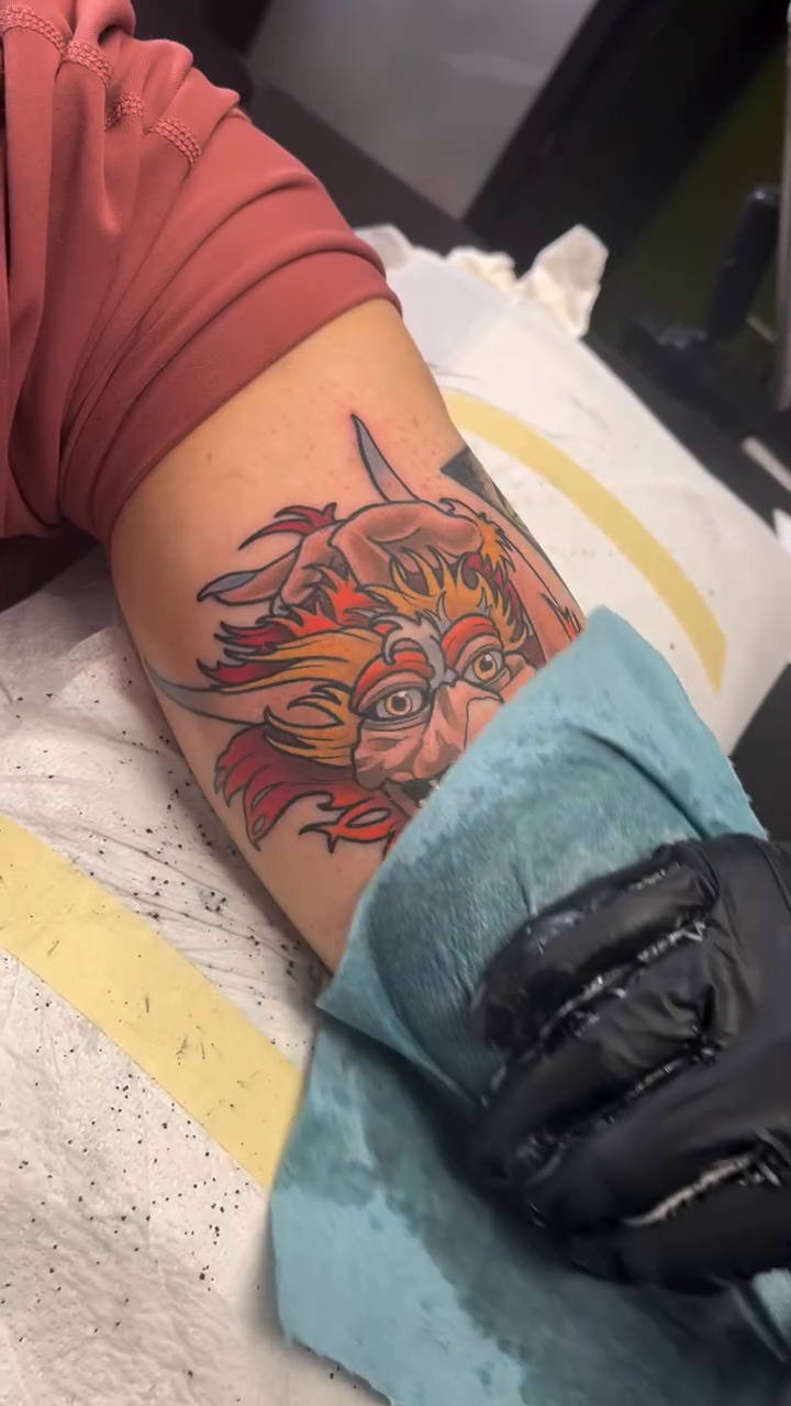 Dragon face realism tattoo on the upper arm by Kiel Ferrari