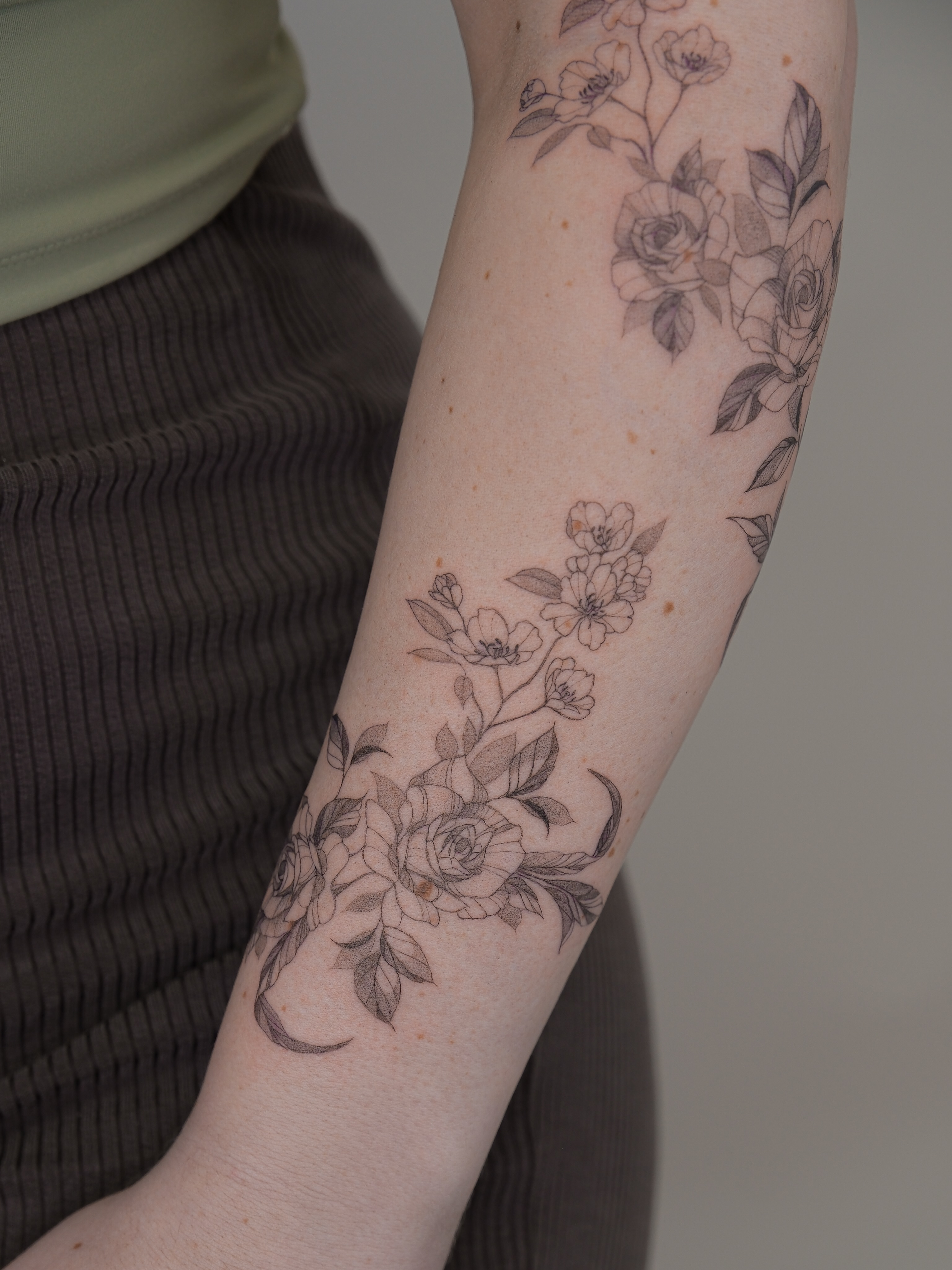 Floral arrangement black and grey tattoo on the forearm by Tattoo in Charlotte NC, Charlotte, North Carolina