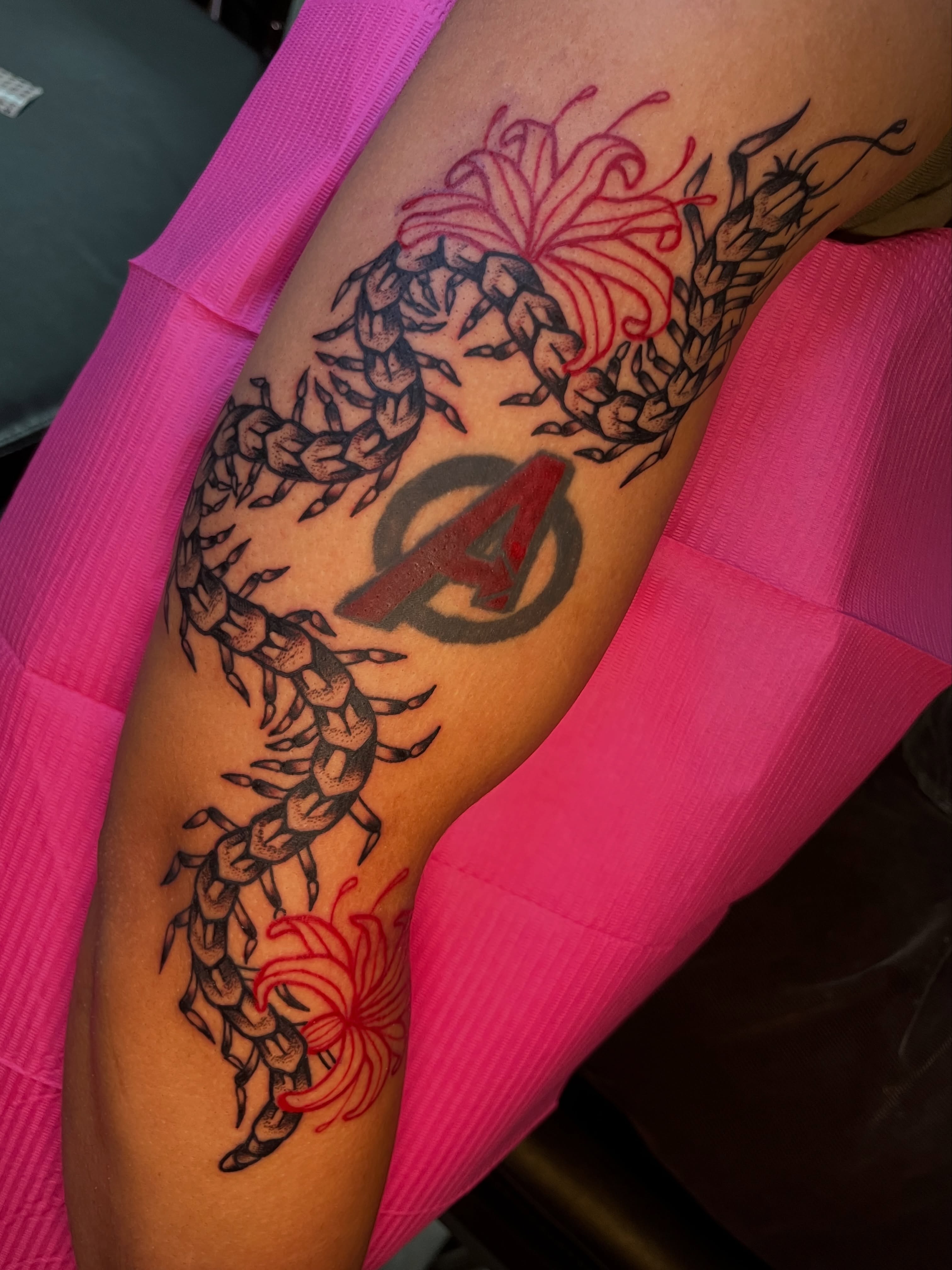 Centipede and chrysanthemum American traditional tattoo on the forearm by Cincinnati Tattoo Artist, Cincinnati