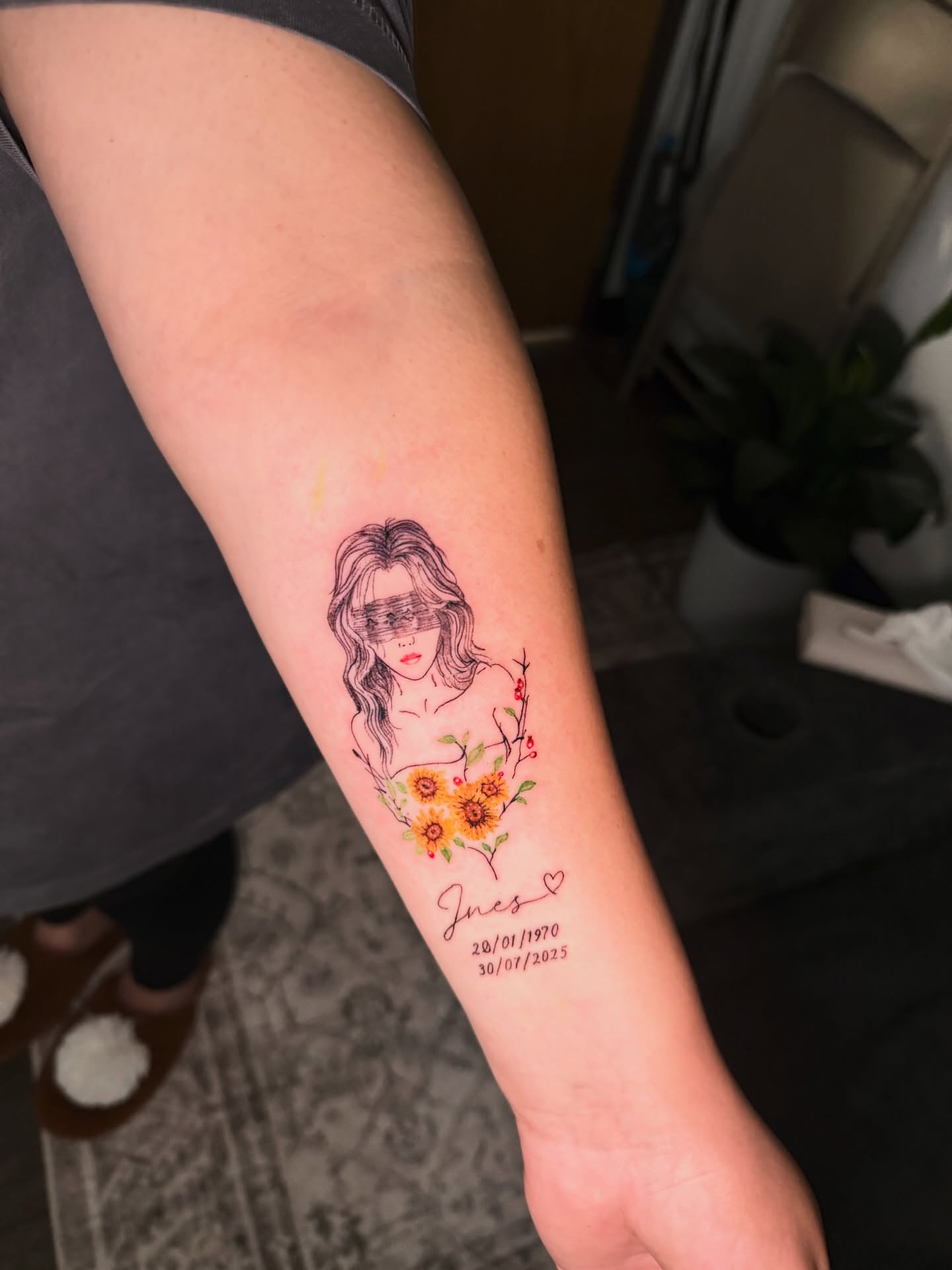 Portrait with floral heart realism tattoo on the forearm by Sebastian martinez, Memphis, Tennessee