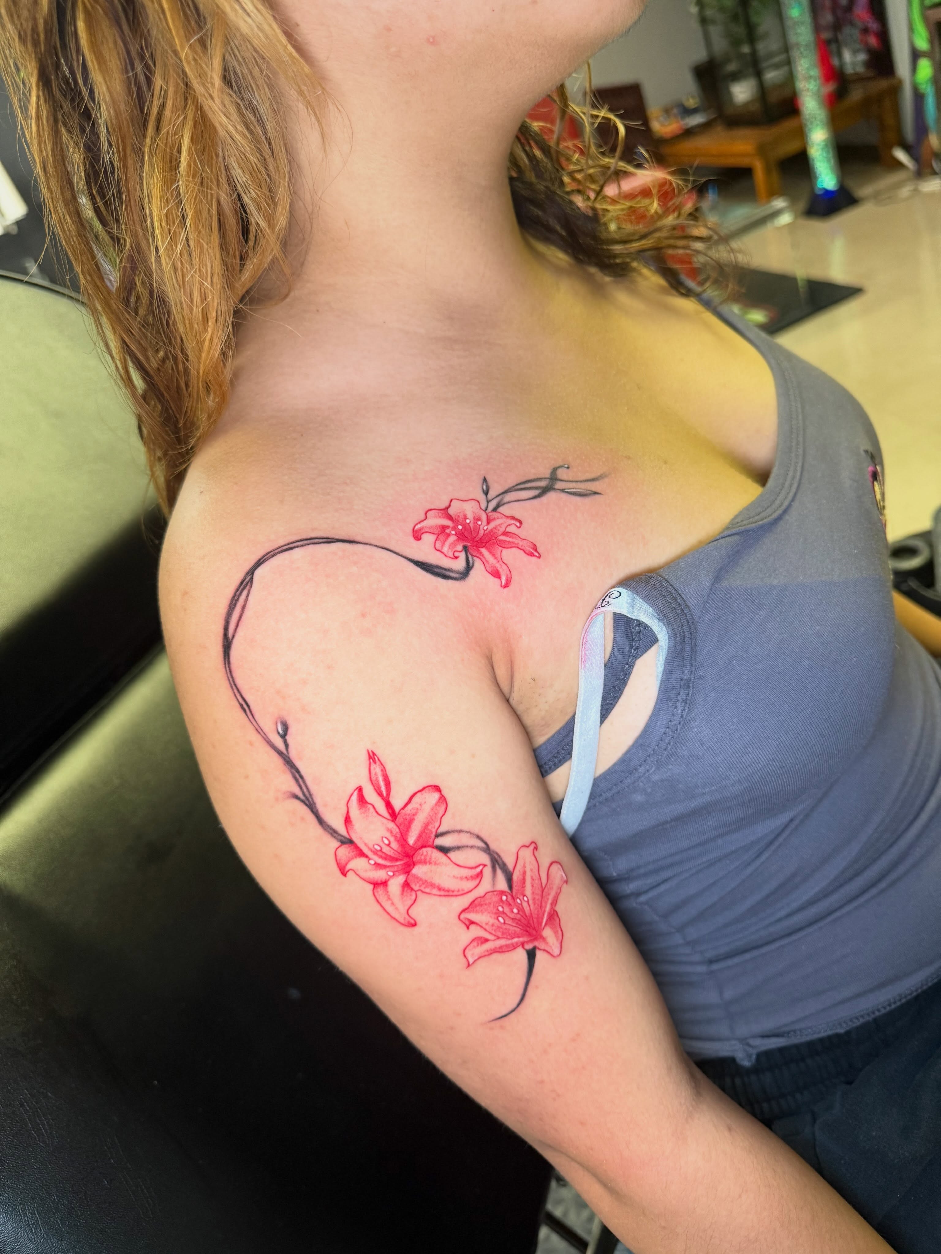 Lily flowers dotwork tattoo on the shoulder by Steve - Tattoo Artist