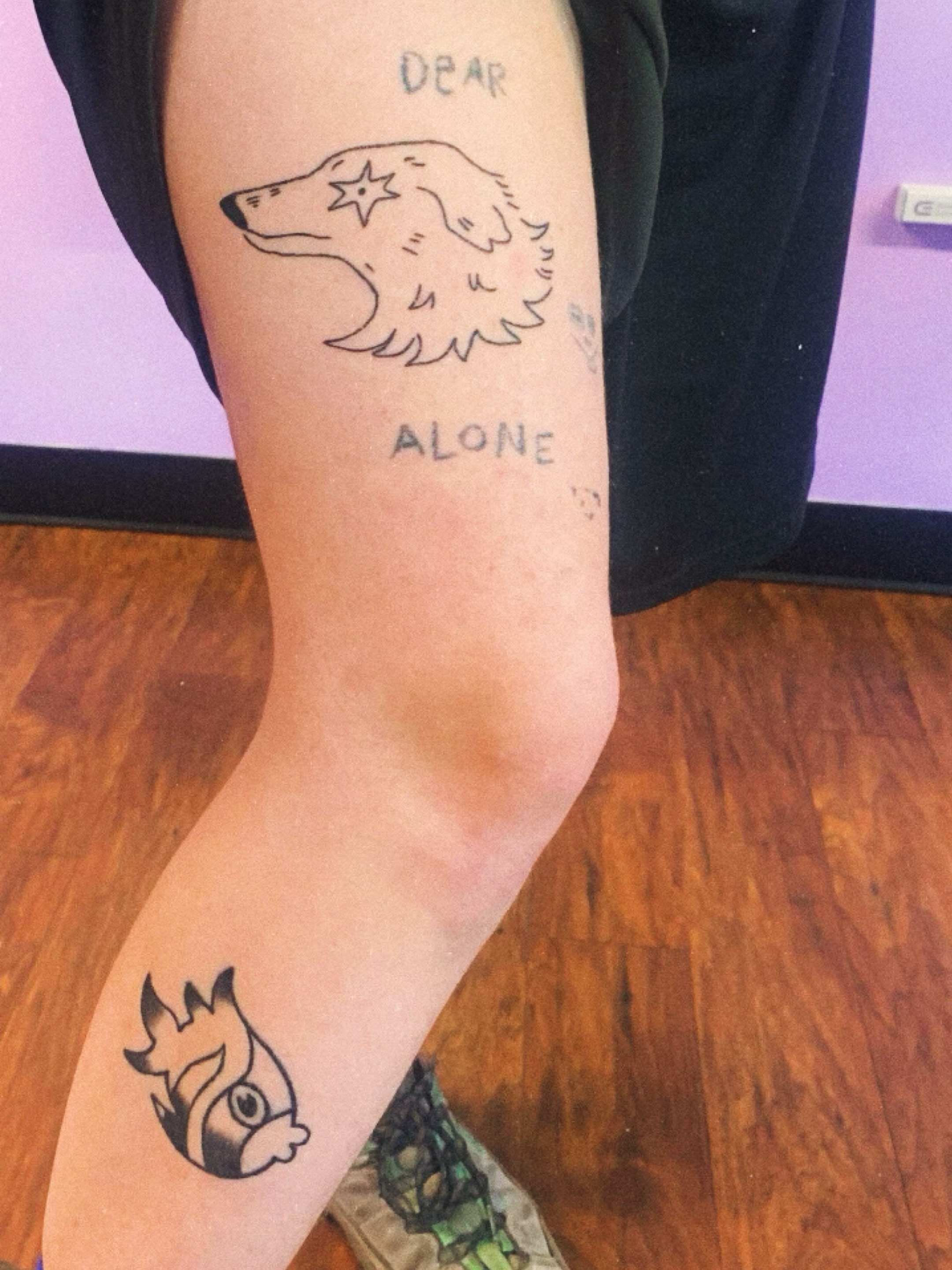 Wolf and fox fine line tattoo on the forearm by charles