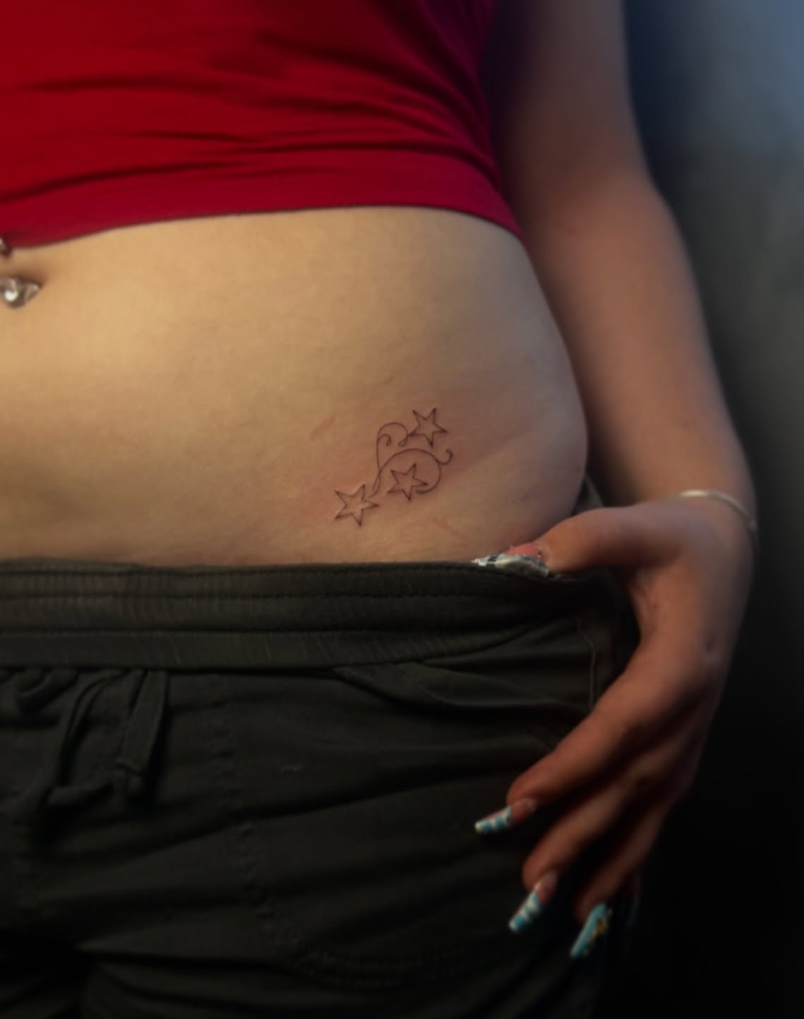 Stars and swirl fine line tattoo on the torso by 𝙸𝚗𝚔𝚊𝚗𝚍𝚕𝚒𝚕𝚢𝚜 🤎💉🐻🌸