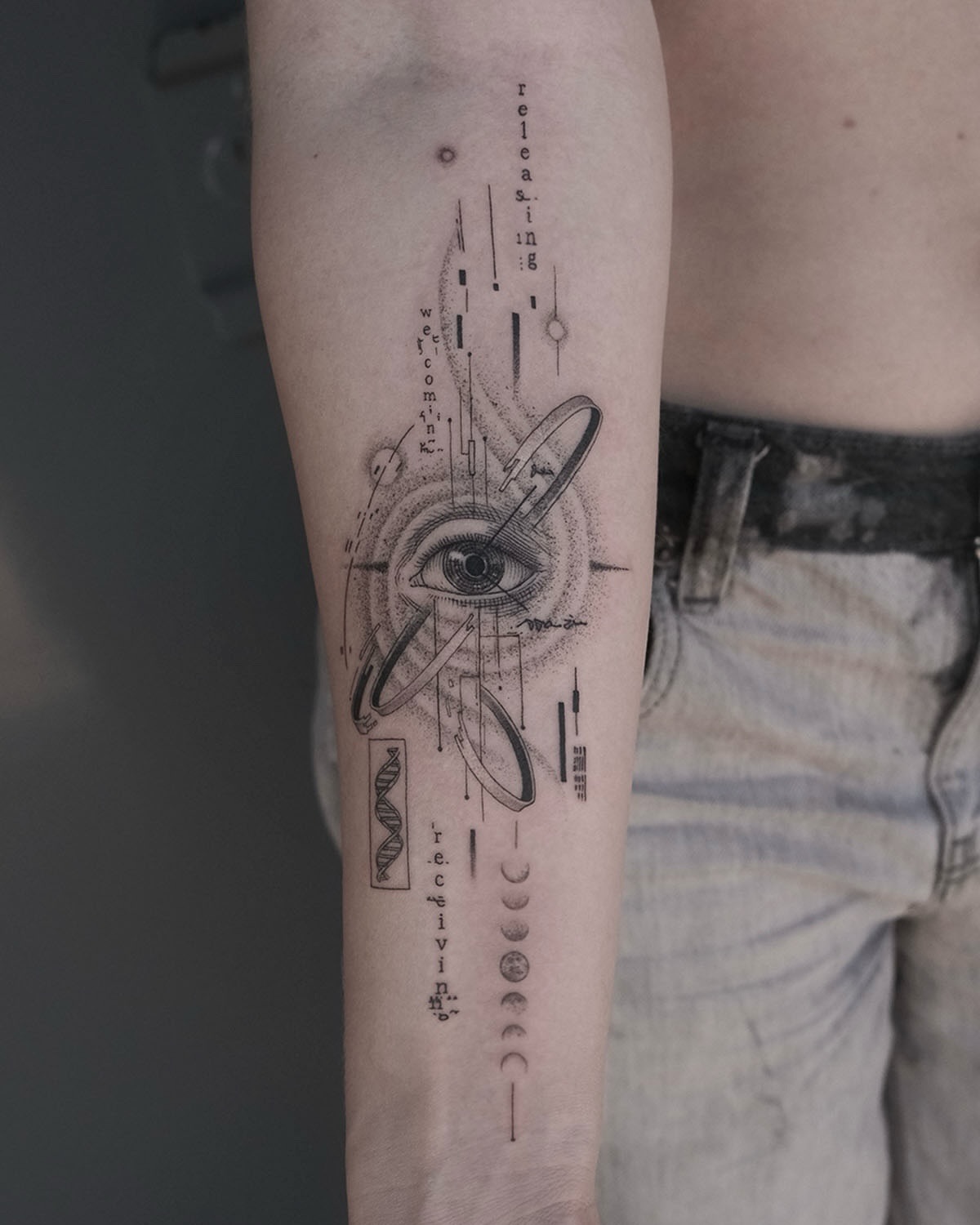 Eye and celestial symbols dotwork tattoo on the forearm by X°