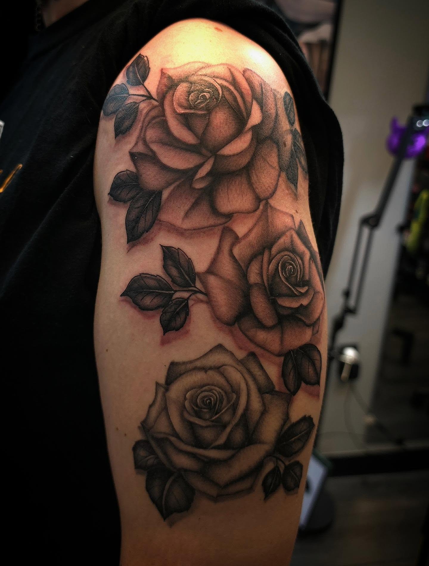 Roses black and grey tattoo on the forearm by Danielle Elizabeth