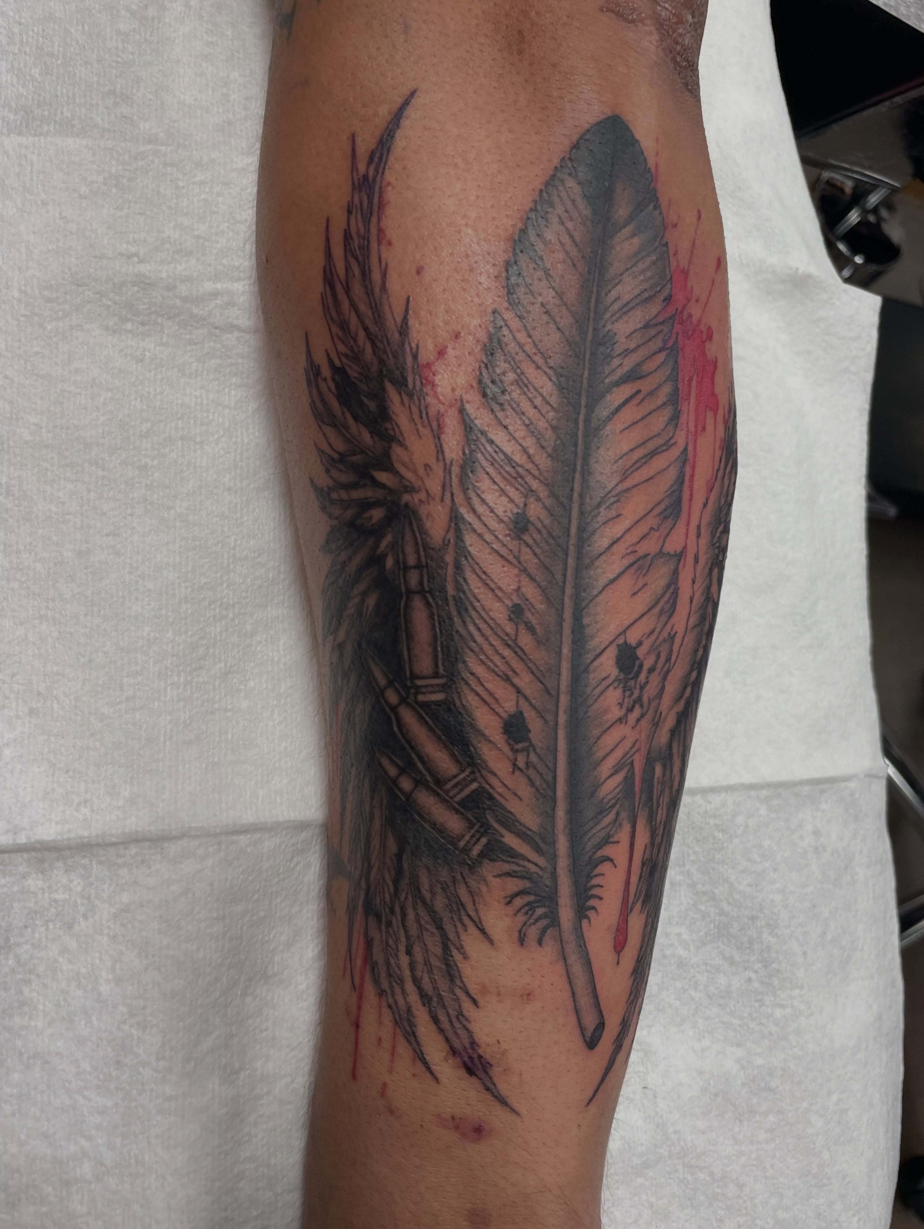 Feather black and grey tattoo on the forearm by Moses (Mo) 🇵🇭