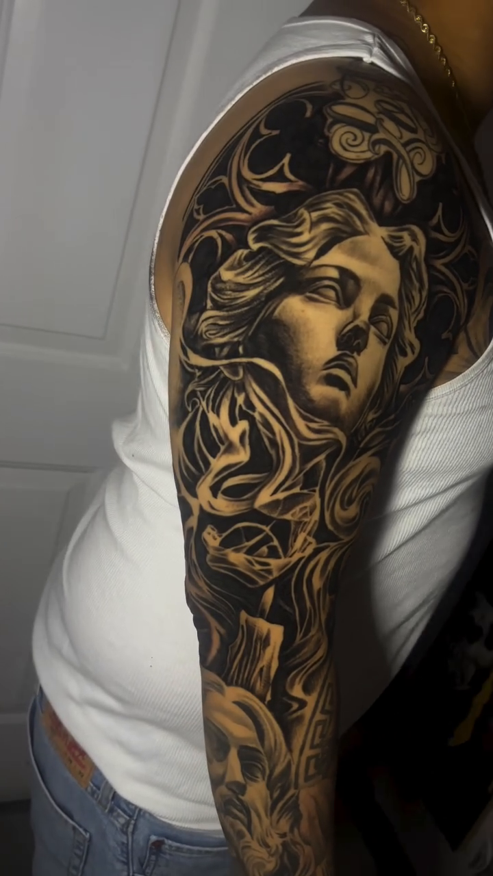 Medusa portrait sleeve realism tattoo on the upper arm by michael