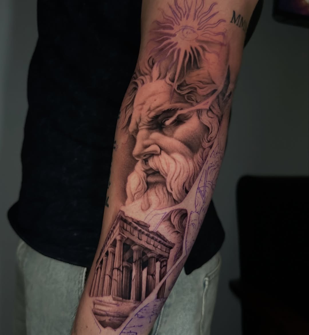 Greek god and temple realism tattoo on the forearm by Trent Hebert