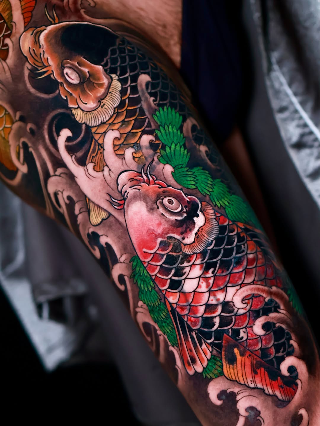 Koi fish and waves Japanese tattoo on the forearm by Hocheon
