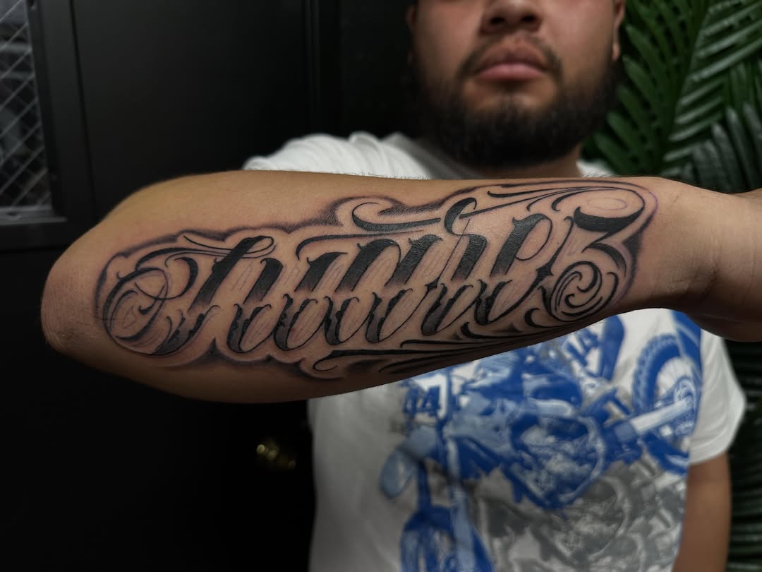Script lettering lettering script tattoo on the forearm by DFW