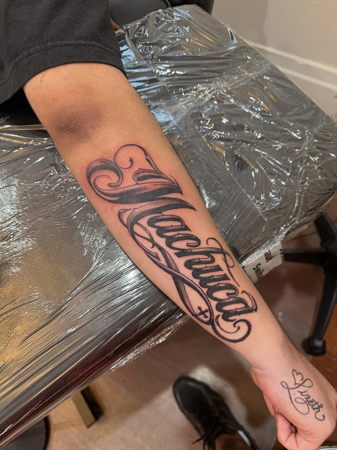 Tattoo by @celestine.art — lettering_script, chicano