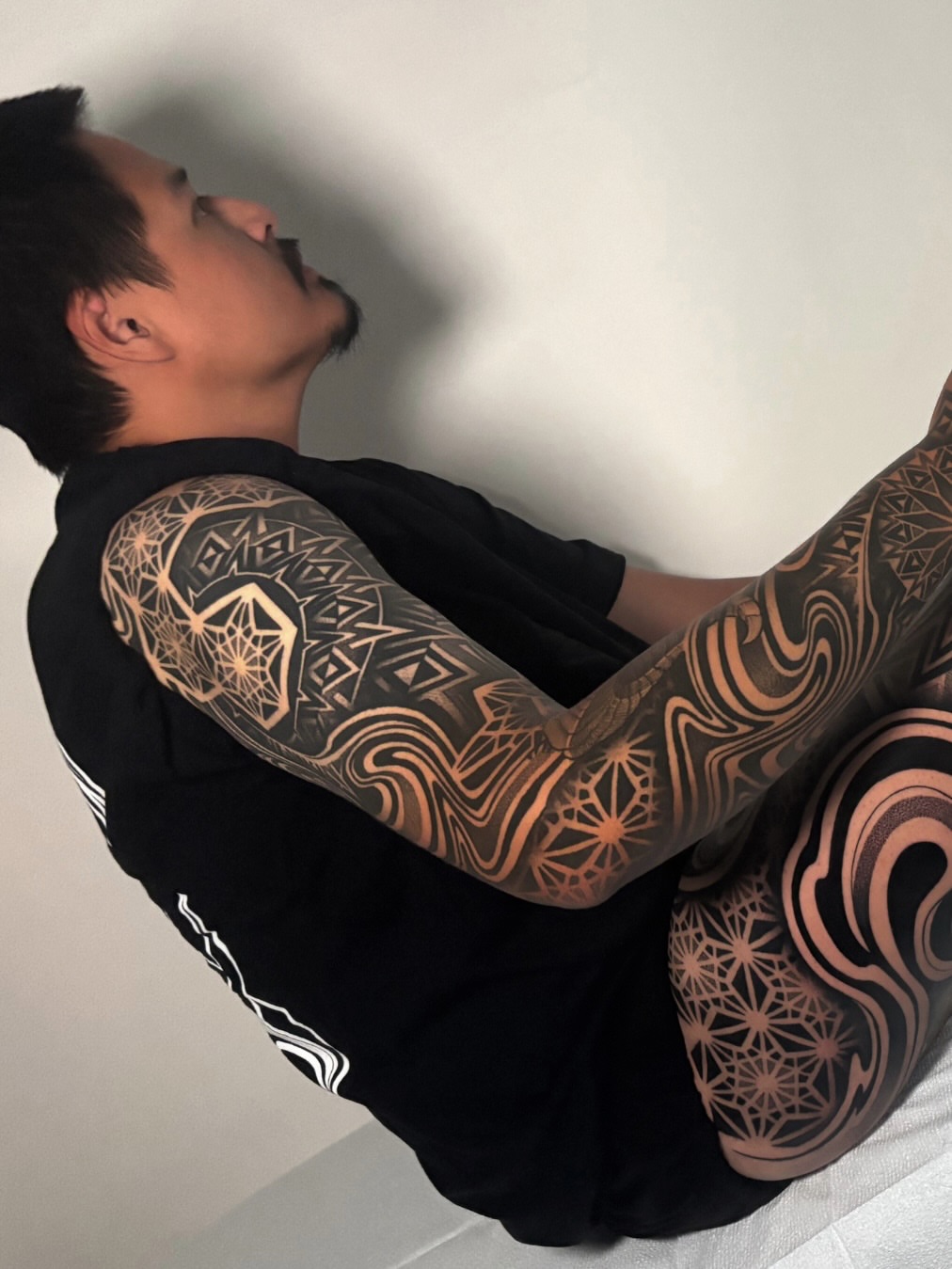 Geometric patterns geometric tattoo on the upper arm by Mitch Koch