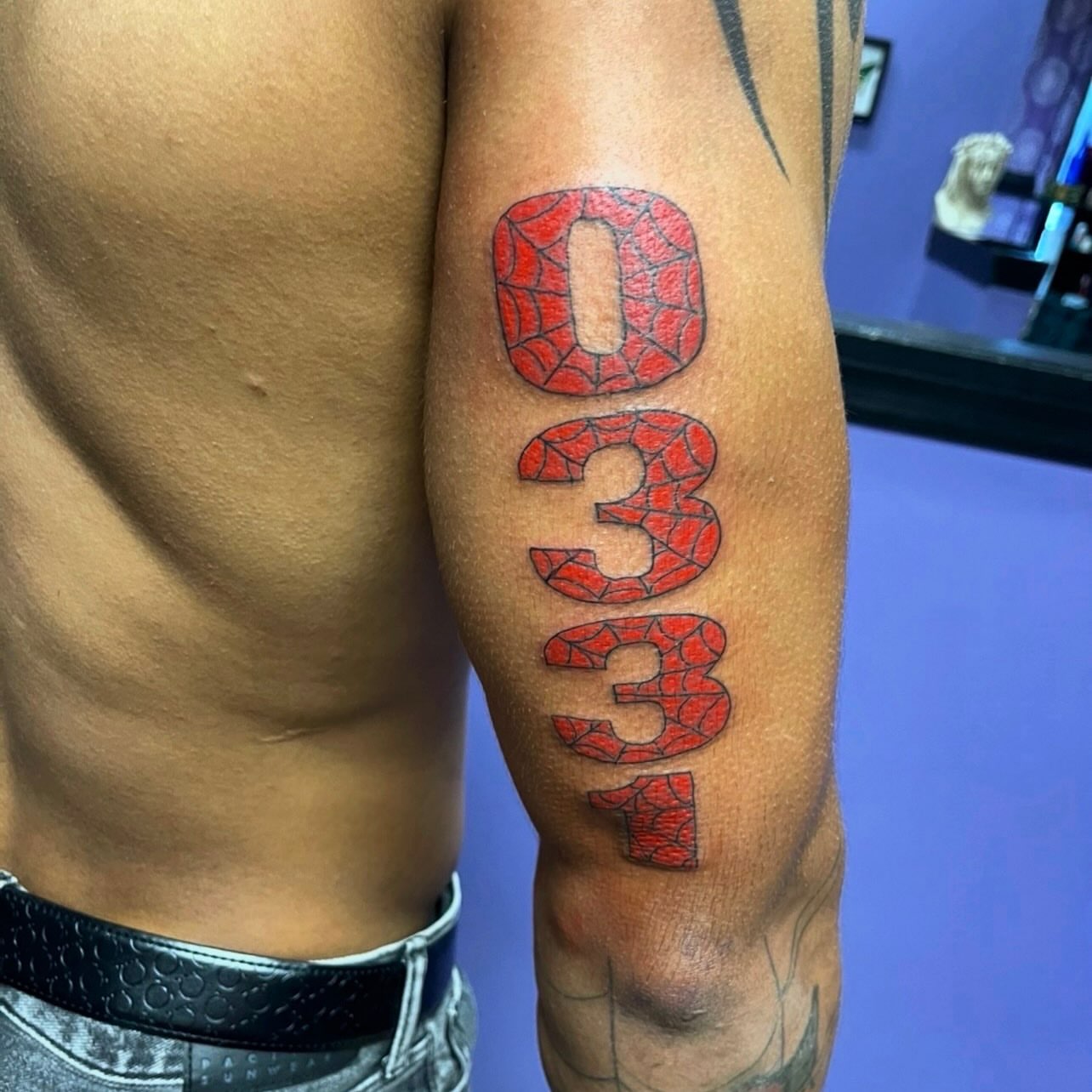 Number tattoo lettering script tattoo on the forearm by Mark Calloway