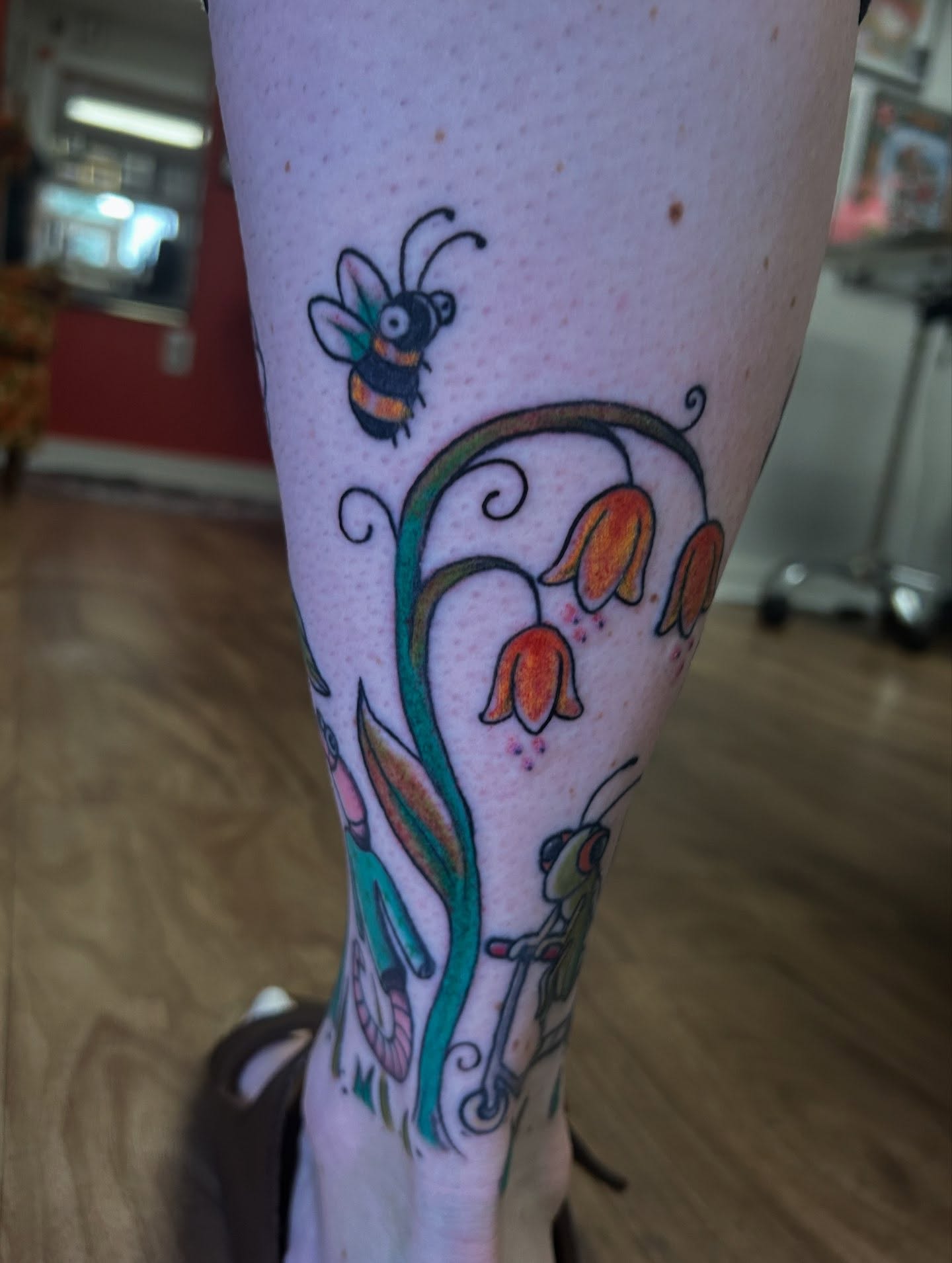 Bee and flowers new school tattoo on the forearm by Sarah π€π»