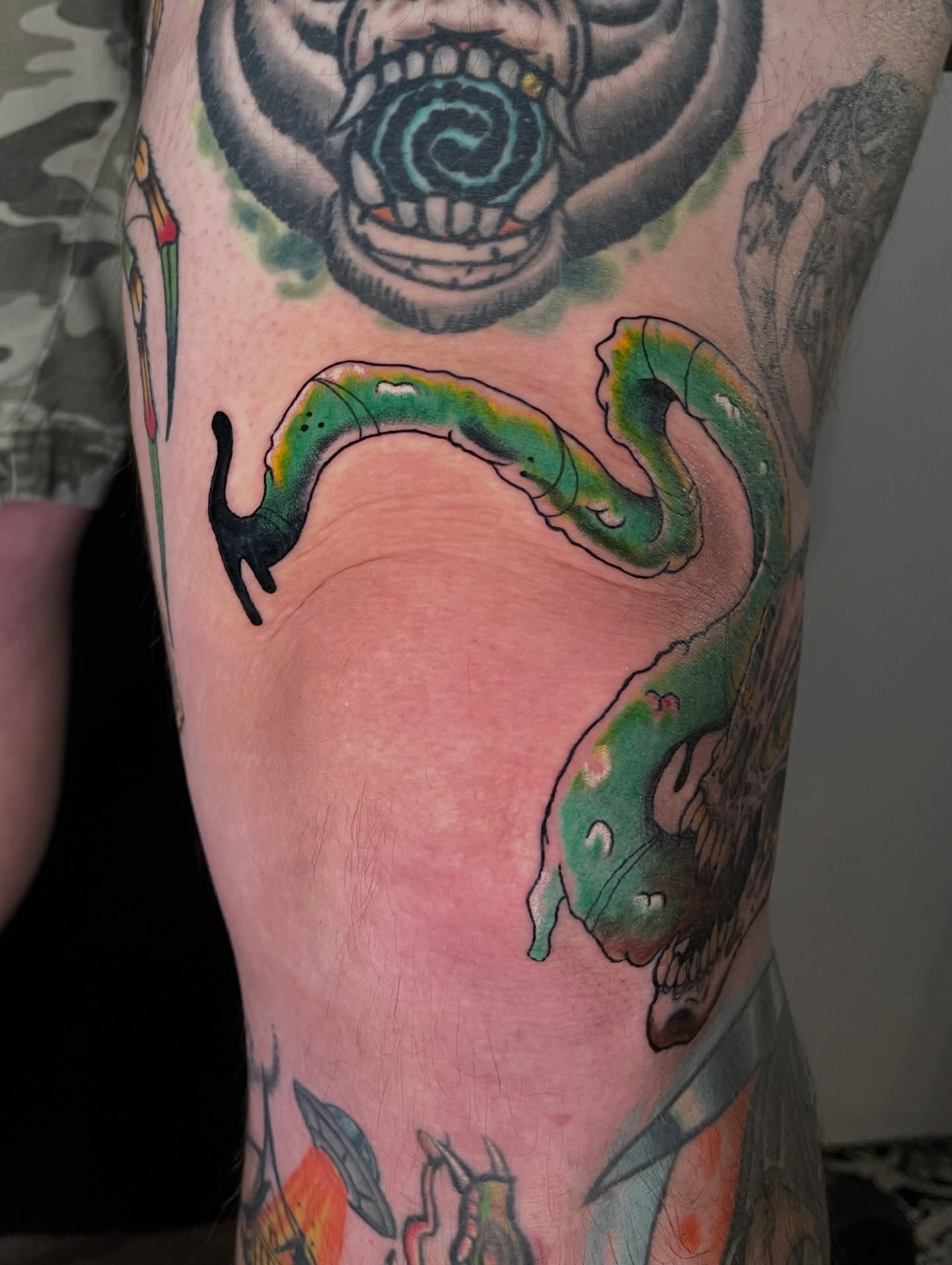 Snake American traditional tattoo on the forearm by Josh Brownell
