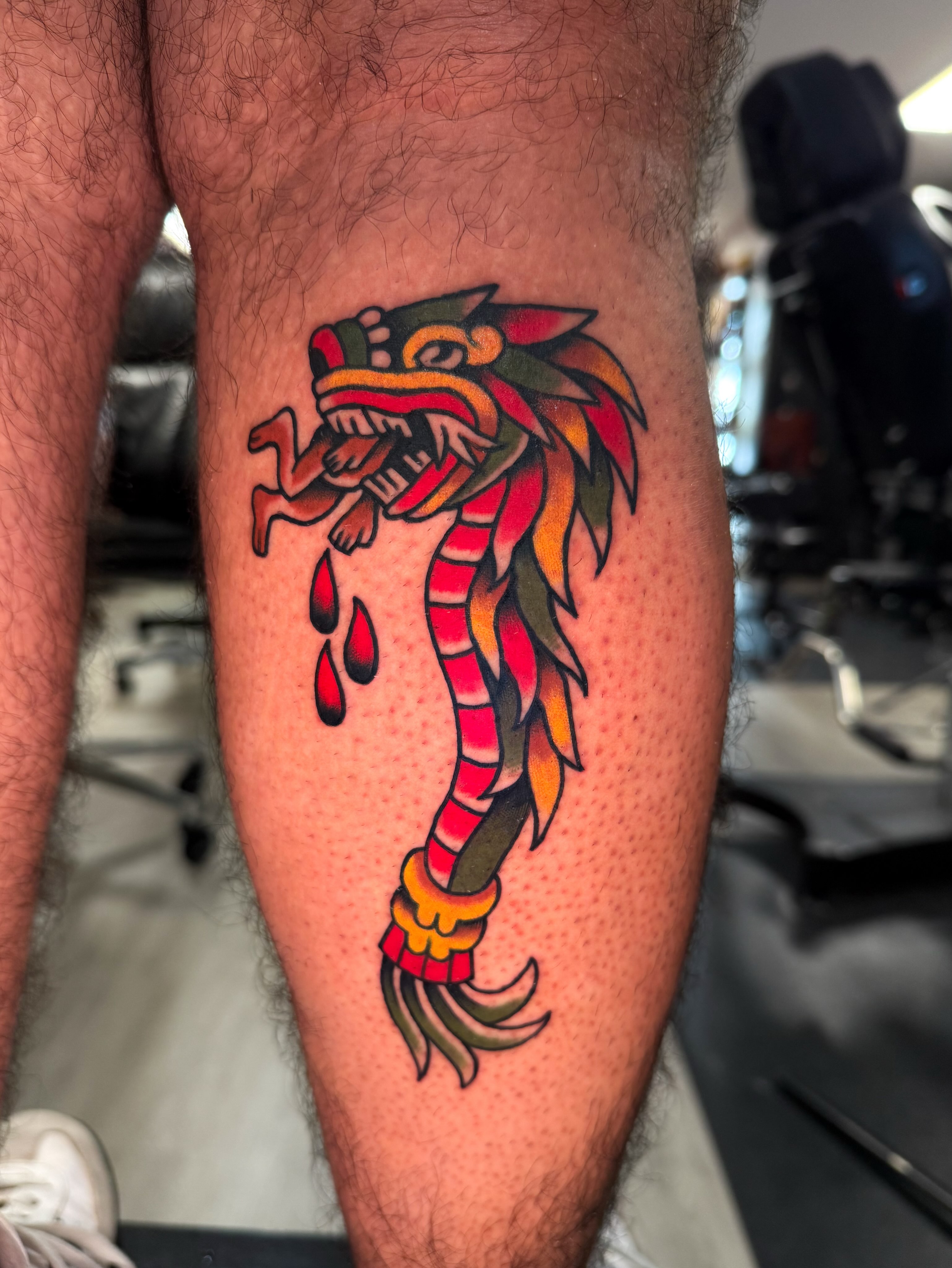 Serpent American traditional tattoo on the leg by Louie Flores