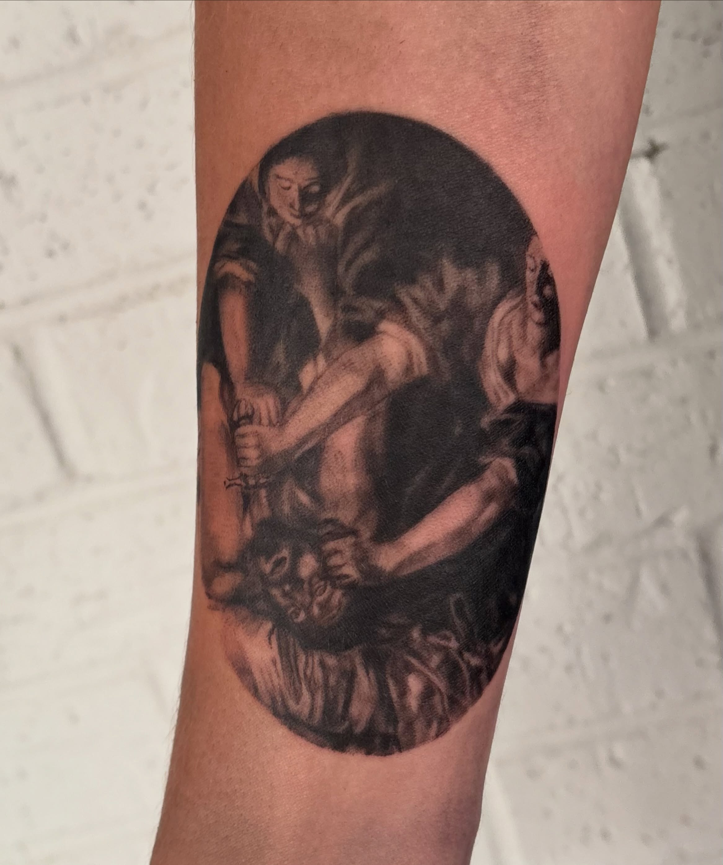 Religious scene realism tattoo on the forearm by jordy