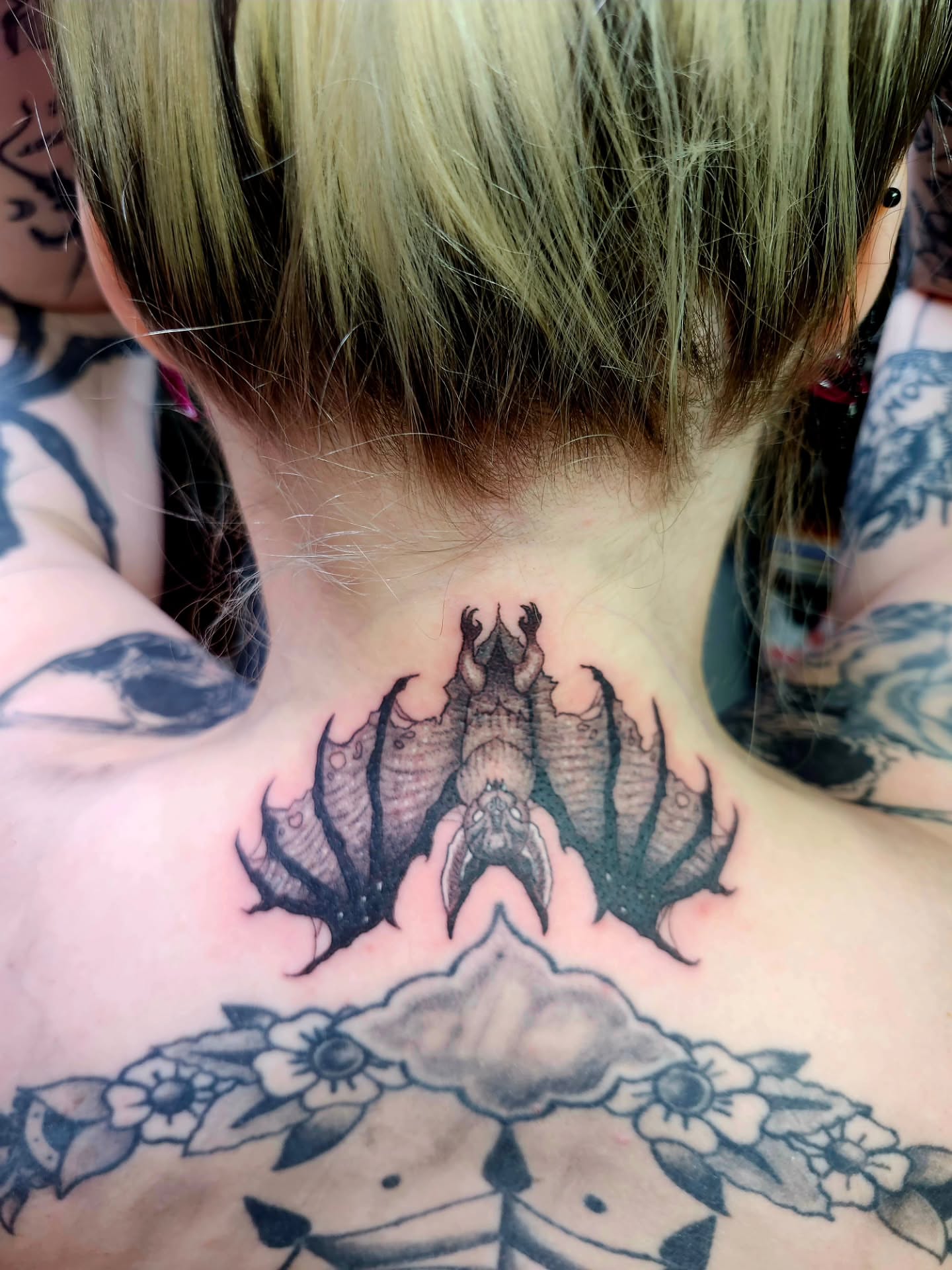 Bat American traditional tattoo on the neck by @rockinr33d.tattoos