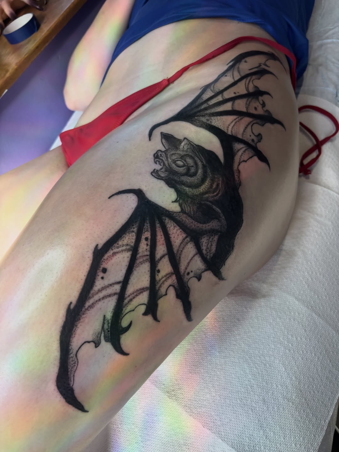 Bat with wings dark art tattoo on the thigh by Nashville Tattoo Artist