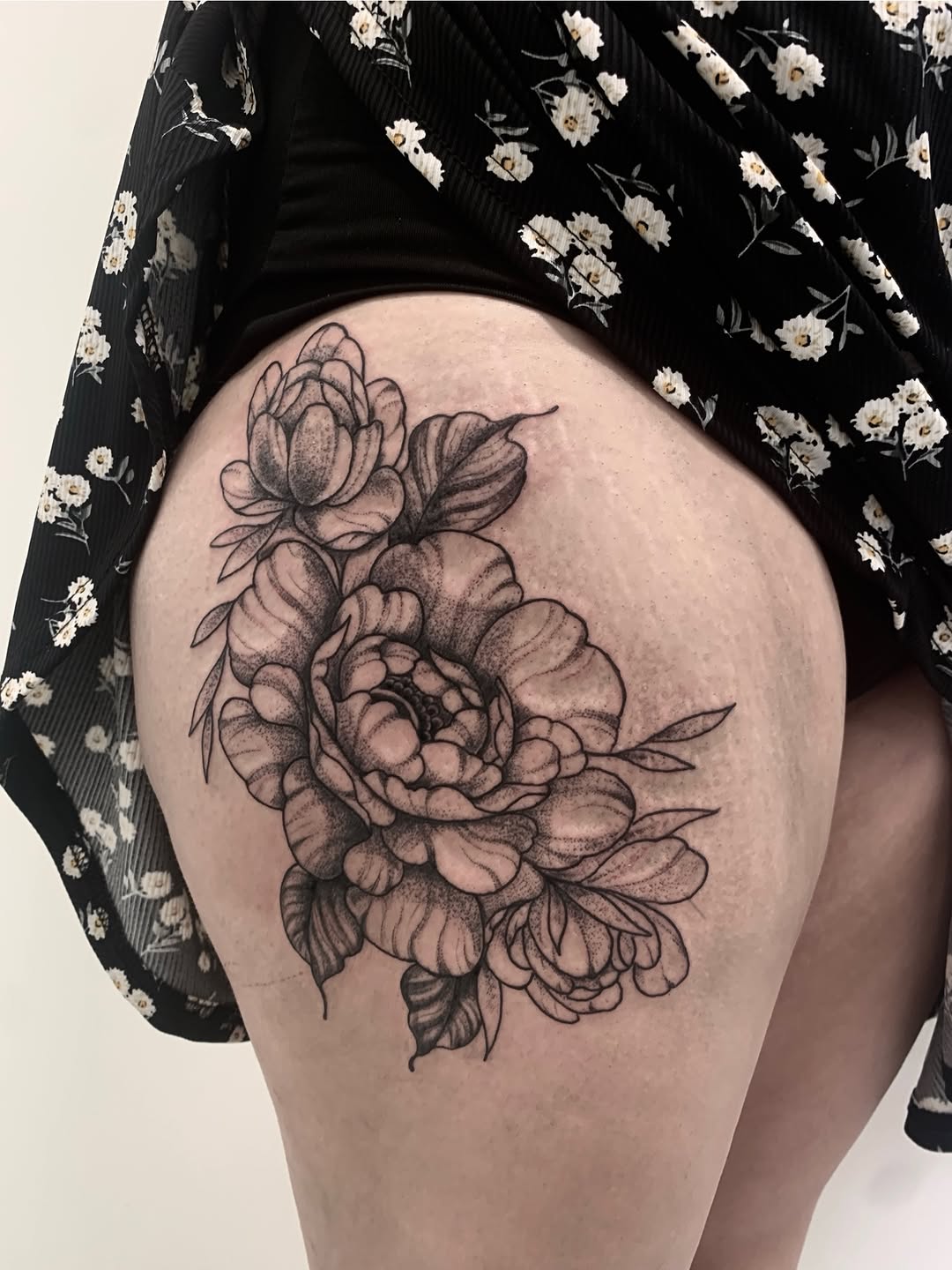 Peonies dotwork tattoo on the thigh by Nashville Tattoo Artist