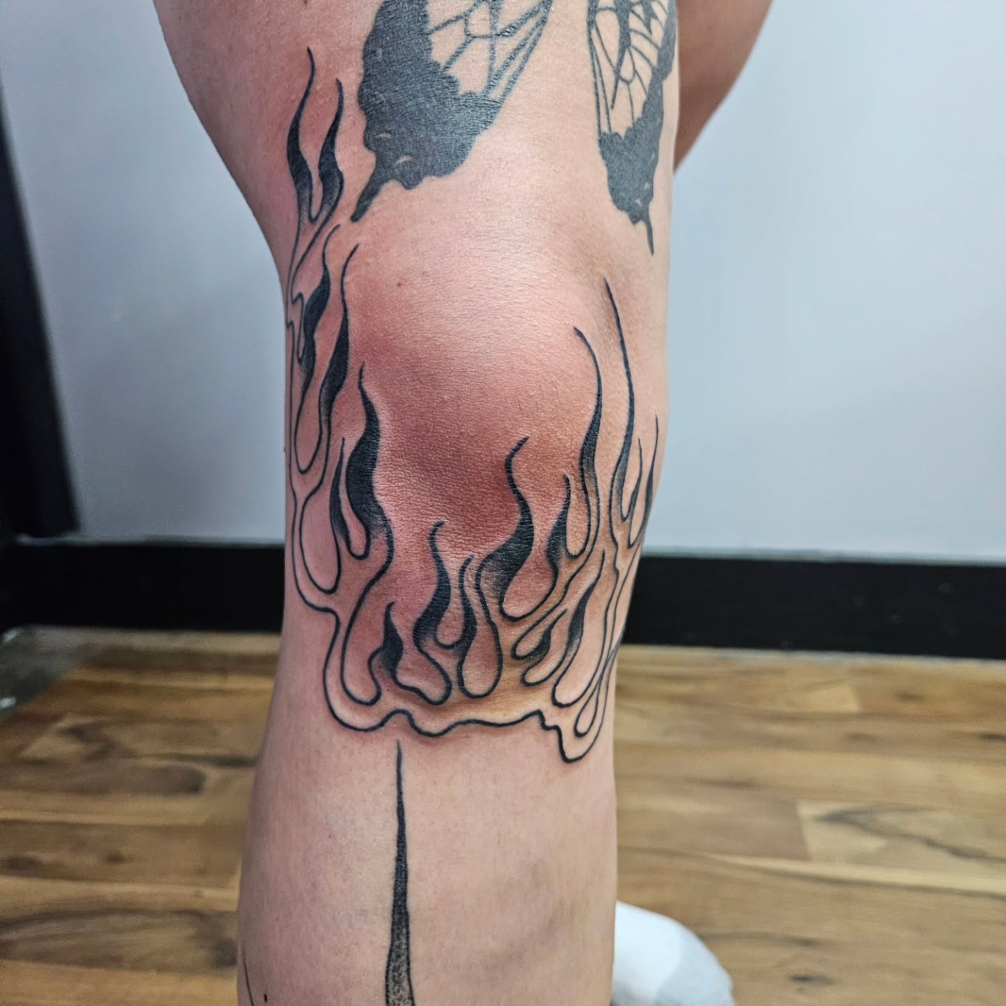 Flames black and grey tattoo on the calf by Danny