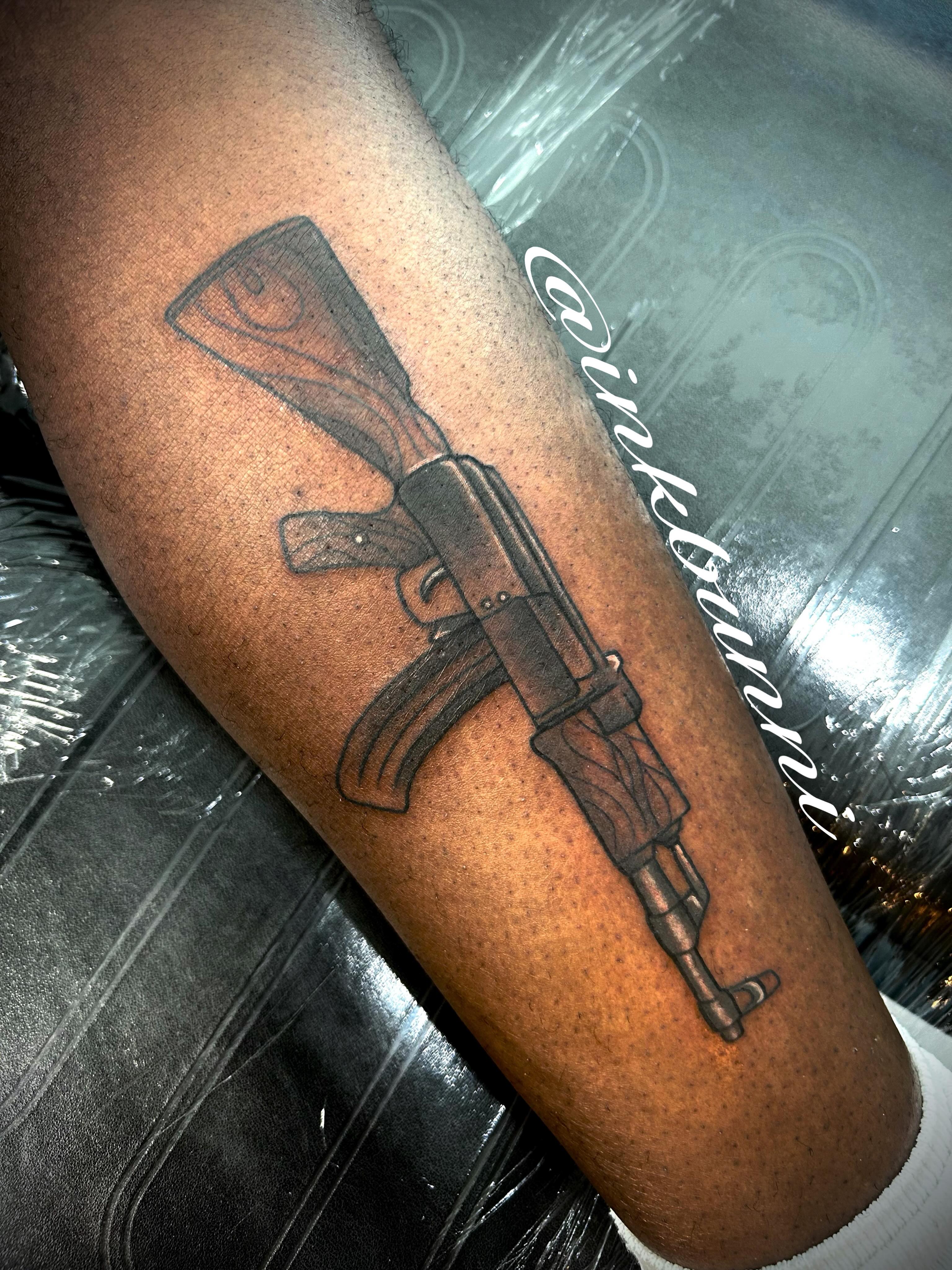 Machine gun black and grey tattoo on the forearm by Hailey Aka inkbunni, Detroit, Michigan