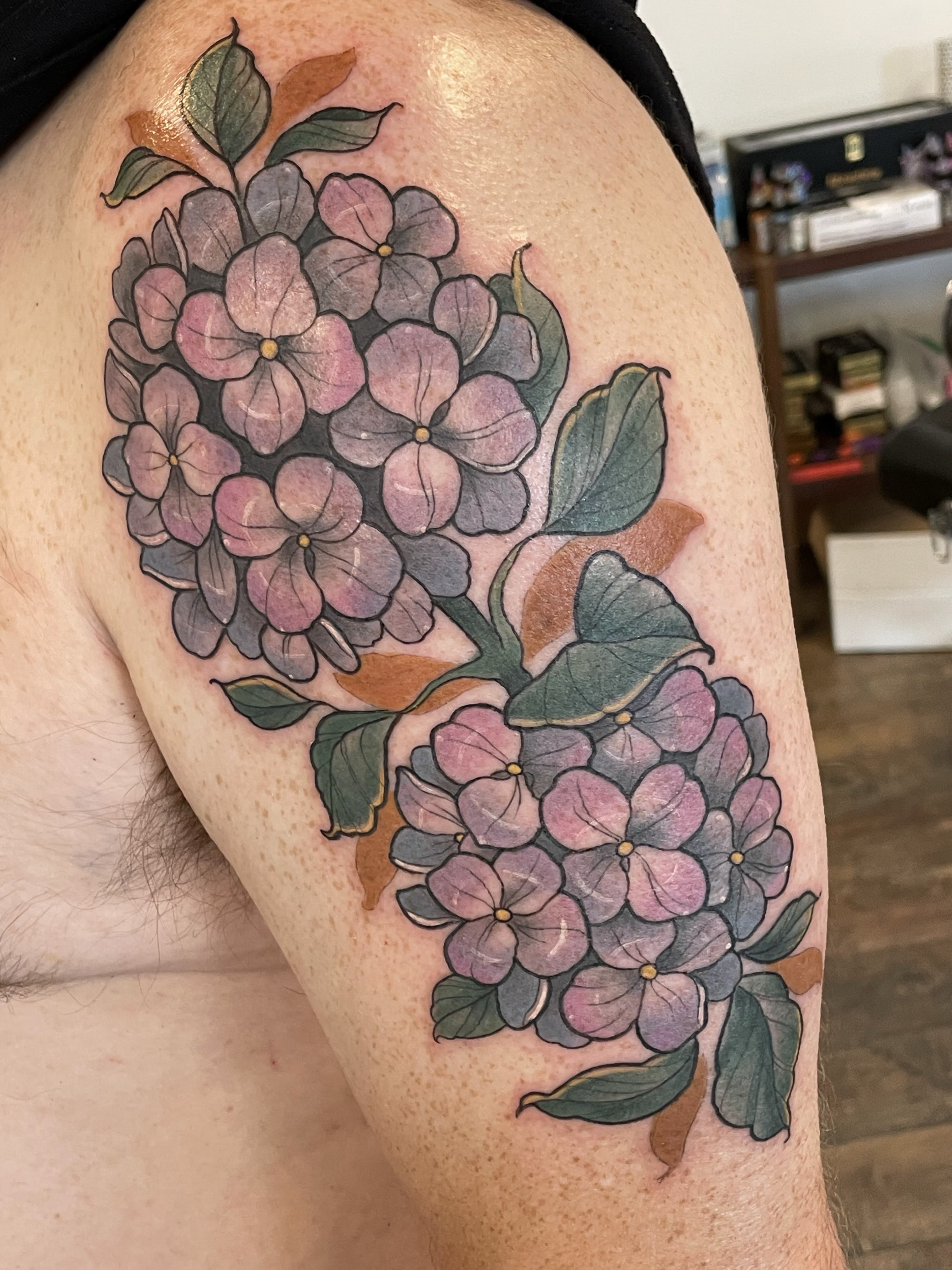Hydrangea bouquet realism tattoo on the thigh by Tanya Murski