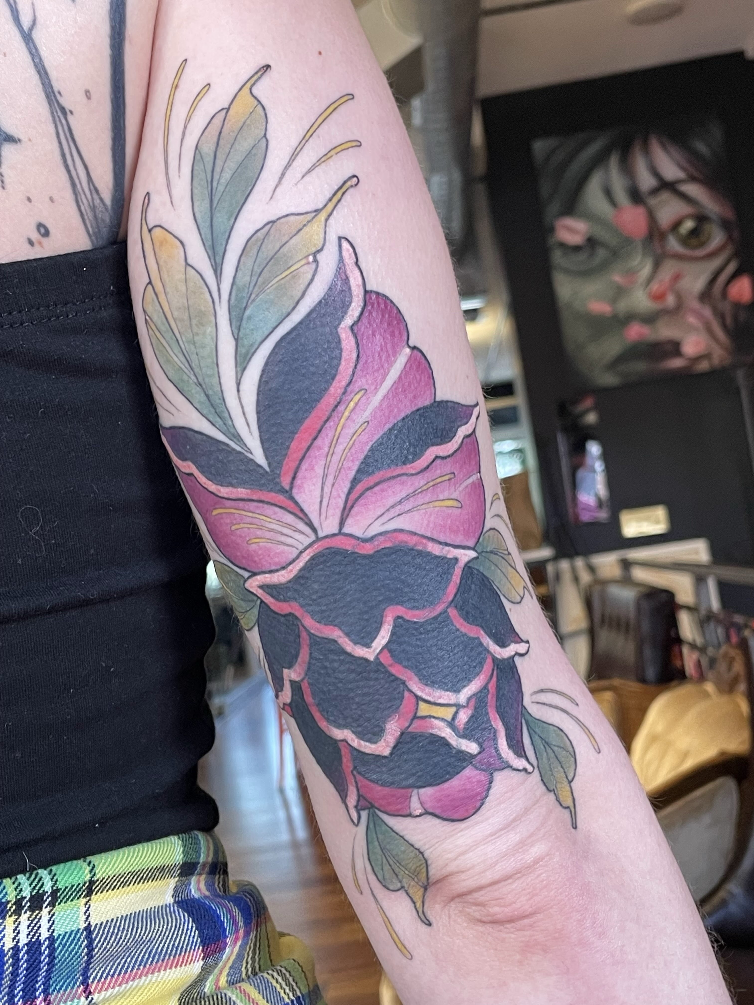 Flower new school tattoo on the forearm by Tanya Murski