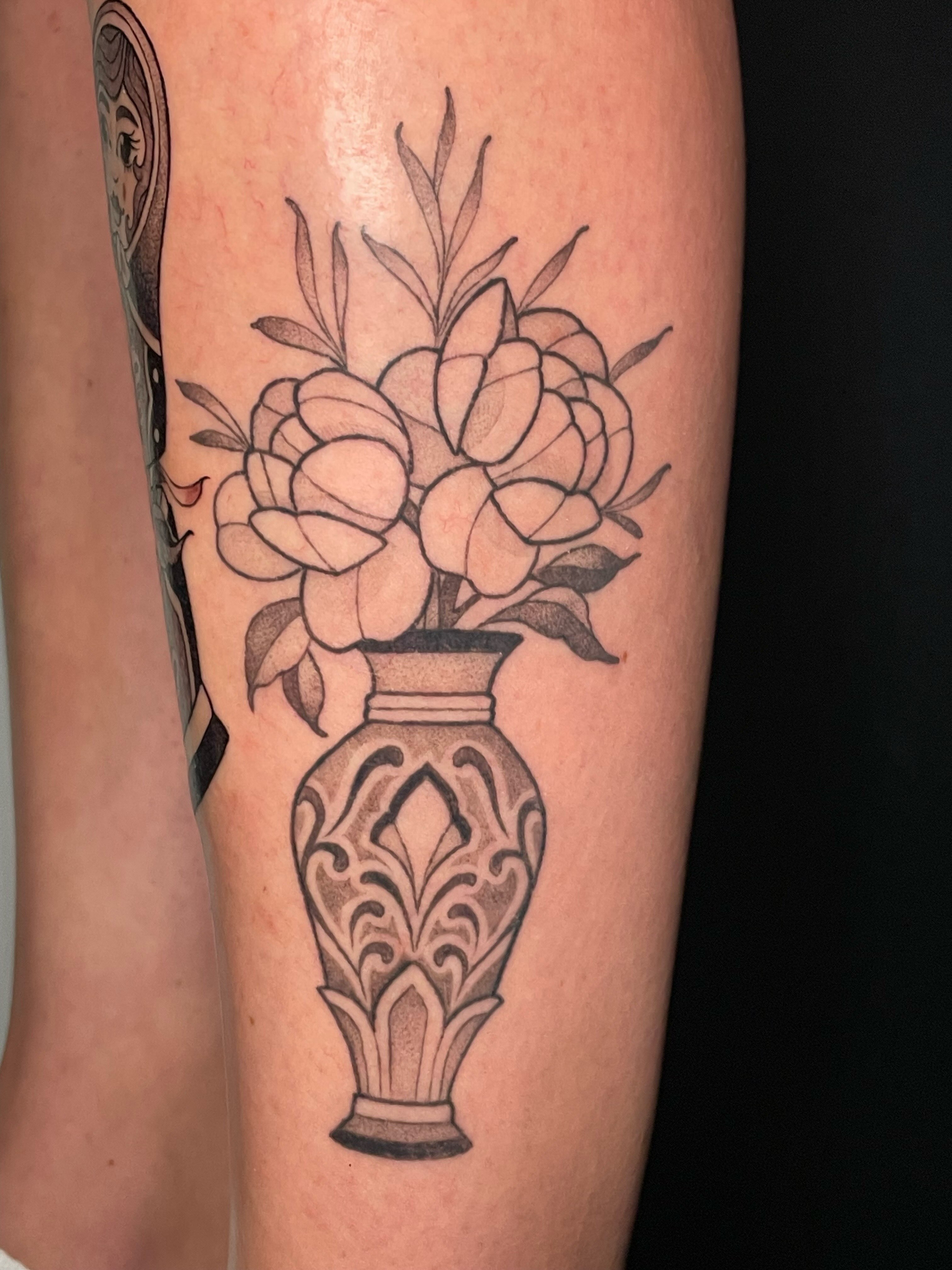 Flowers in vase black and grey tattoo on the forearm by Tanya Murski