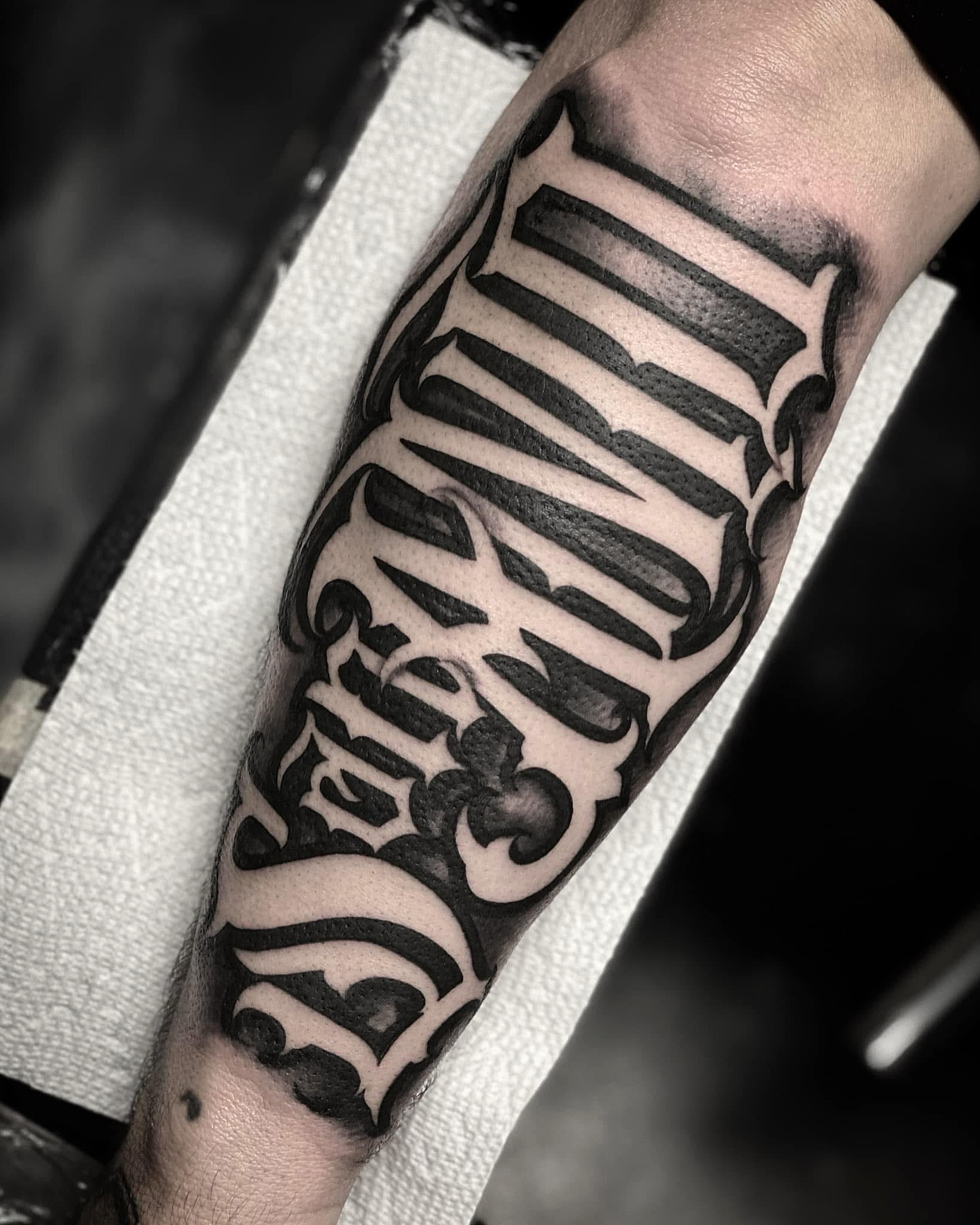 Script lettering lettering script tattoo on the forearm by Lex Miranda