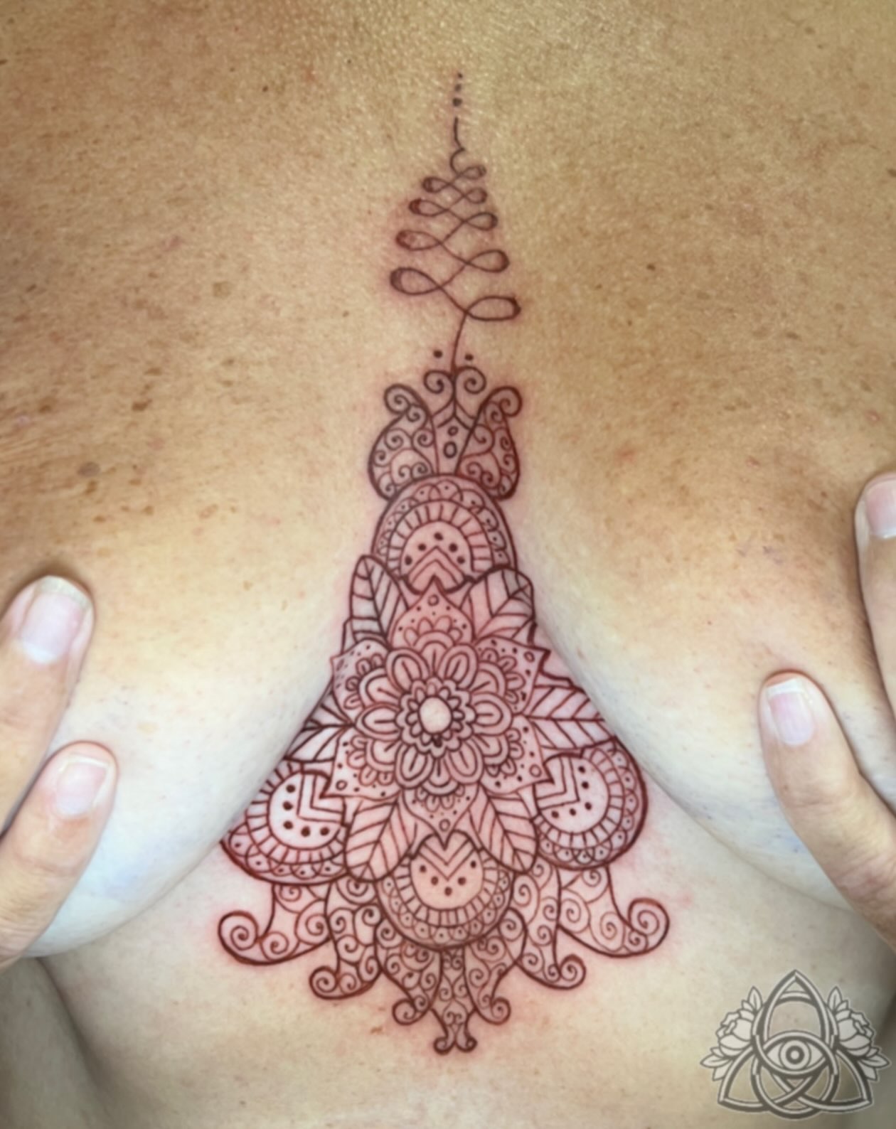 Mandala ornamental tattoo on the chest by Michael - Tattoo Garden Everett, Everett, Washington