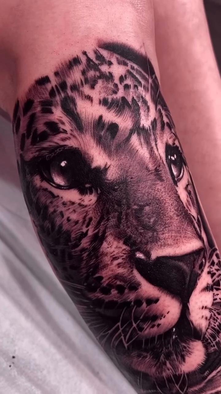 Leopard portrait realism tattoo on the forearm by Erick Gutierrez, Las Vegas, Nevada