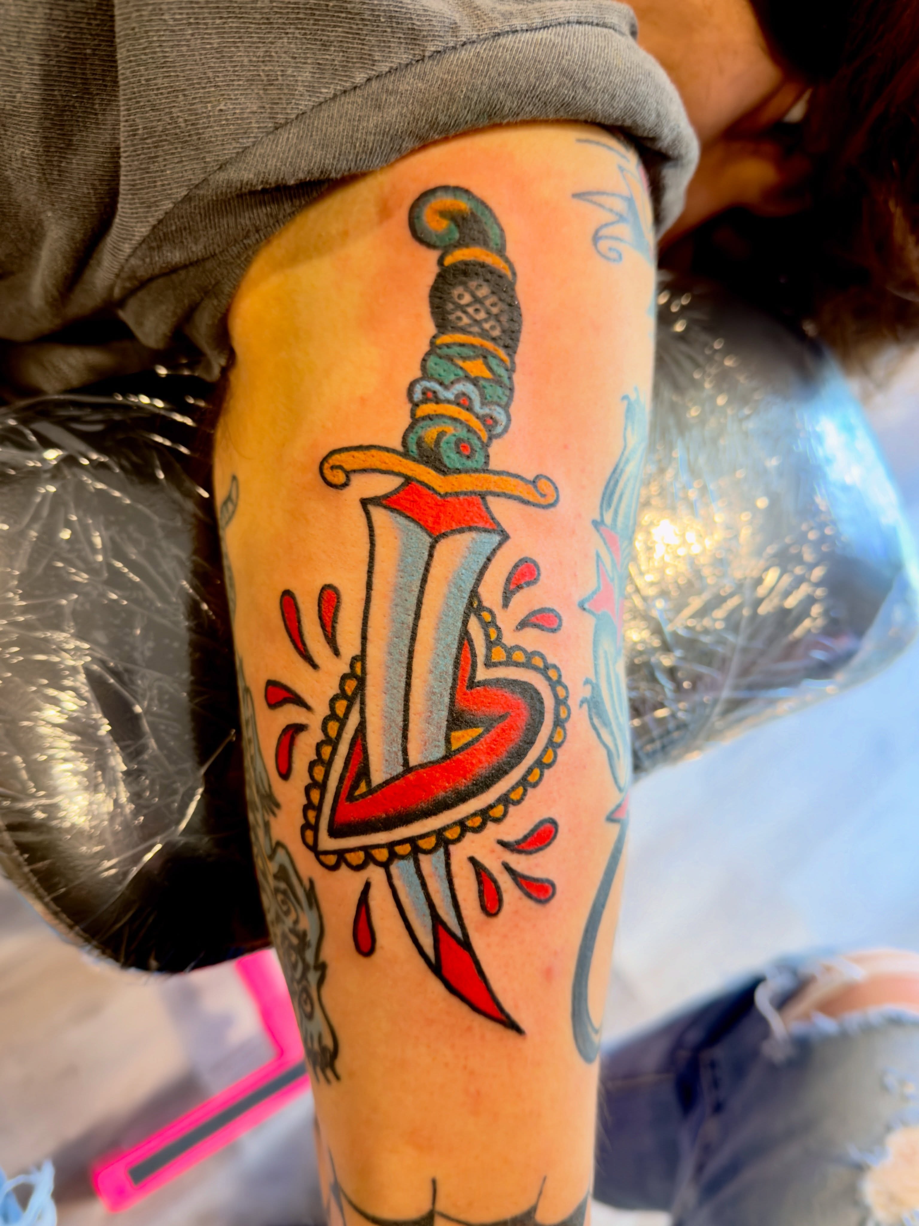 Sword American traditional tattoo on the thigh by Jimmy Kelley