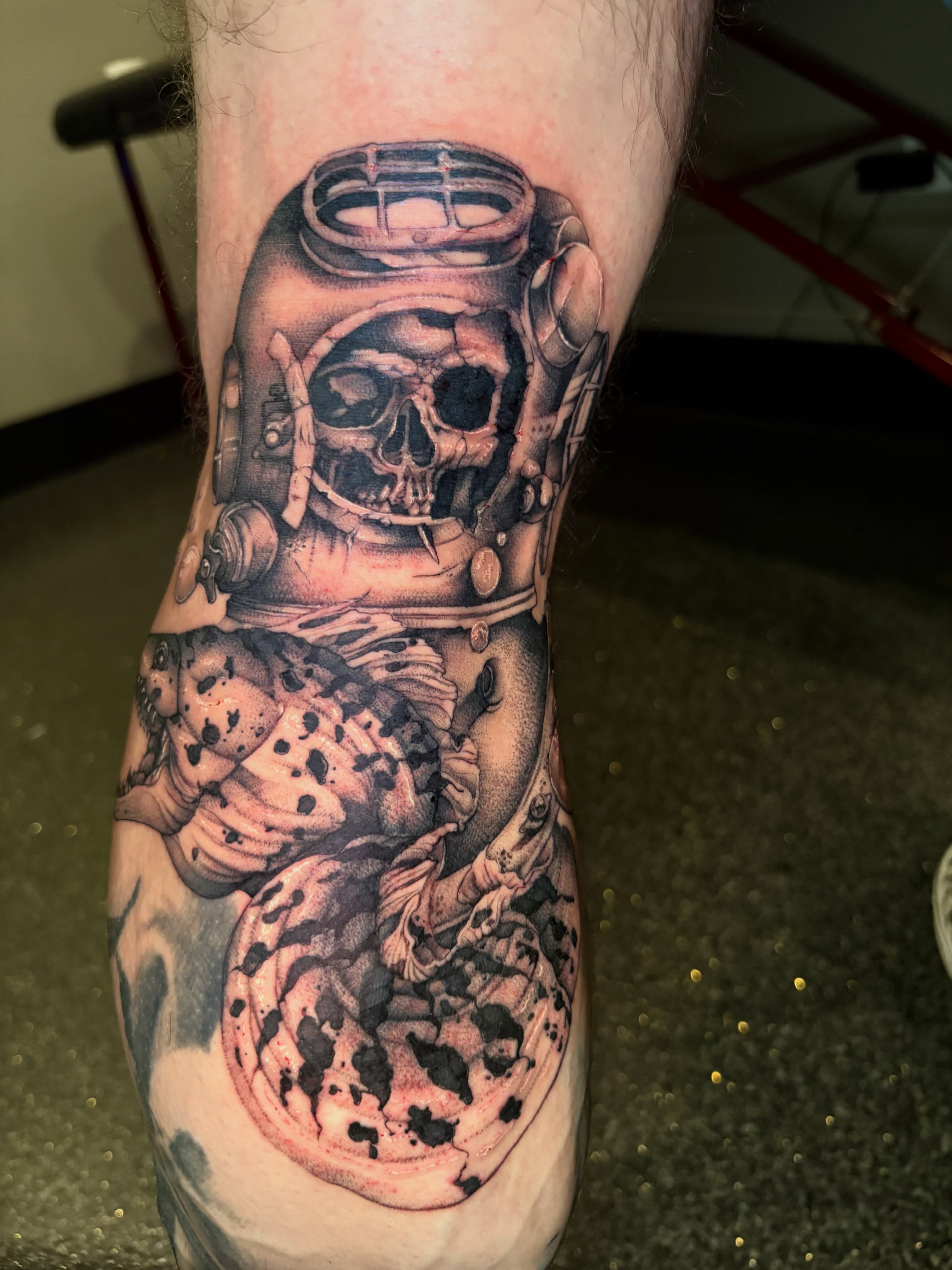 Diver skull realism tattoo on the forearm by Eddie Wolfe