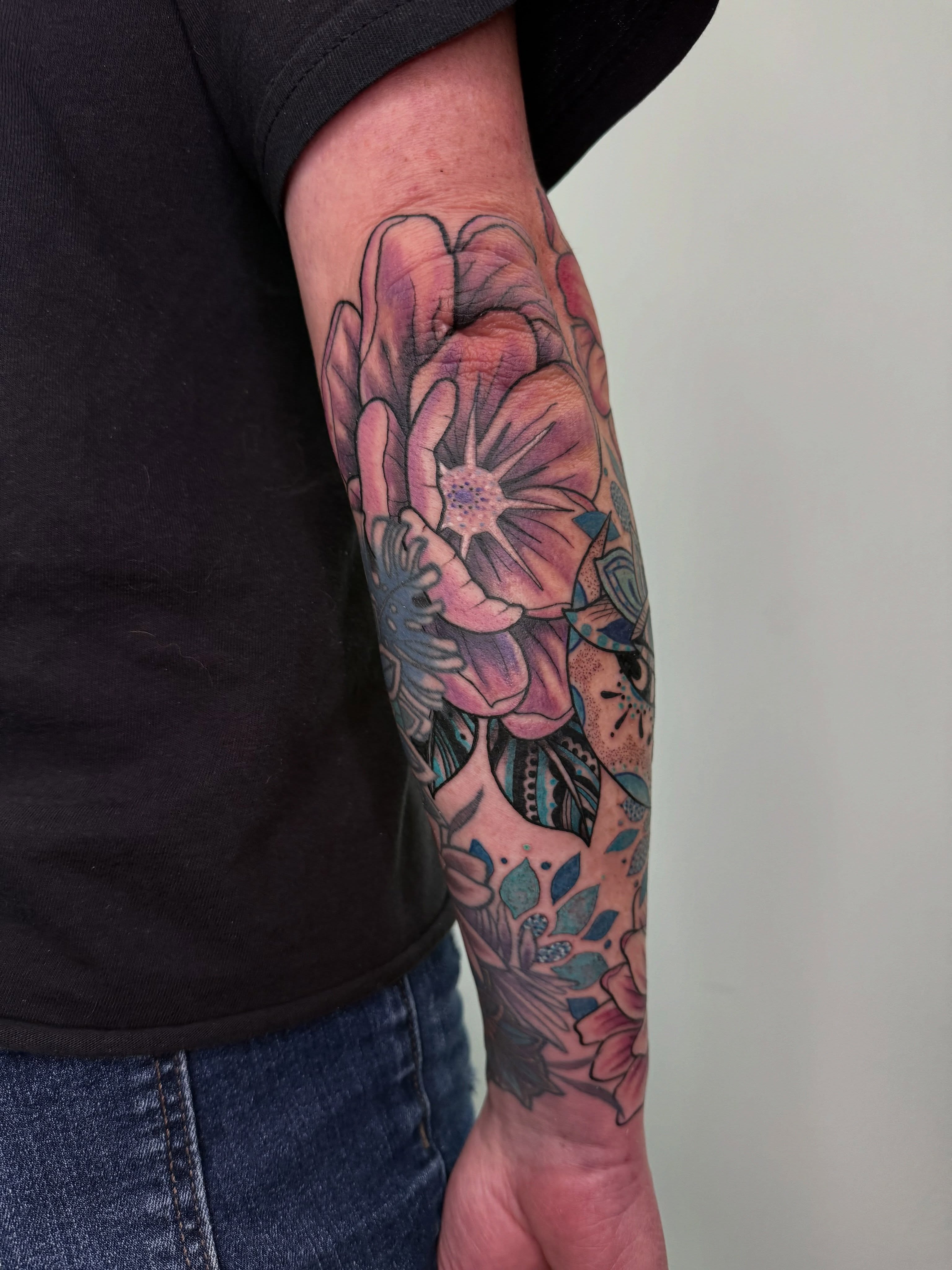 Floral bouquet new school tattoo on the forearm by AJ Jensen