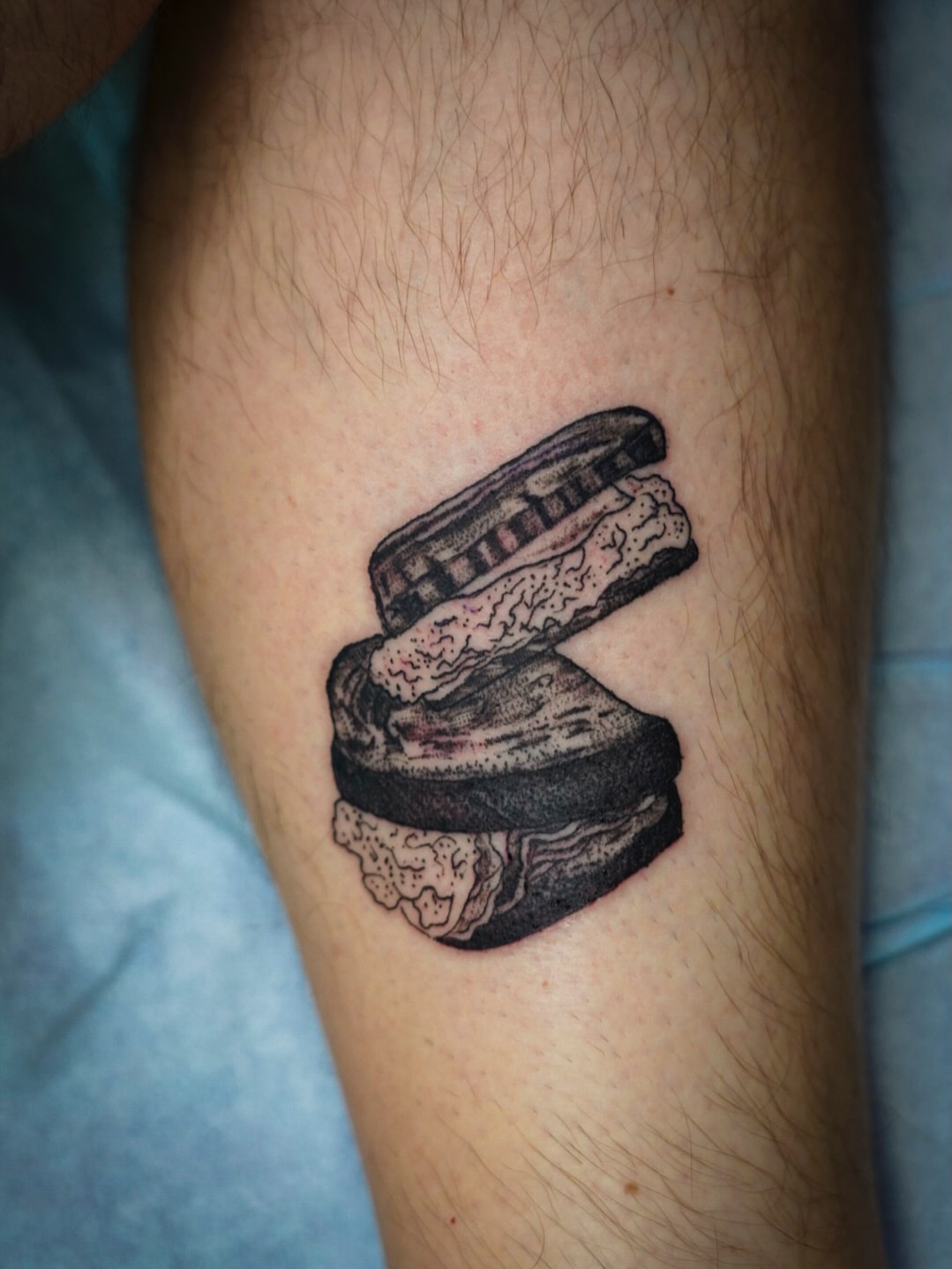 Hamburger black and grey tattoo on the forearm by Spicoli