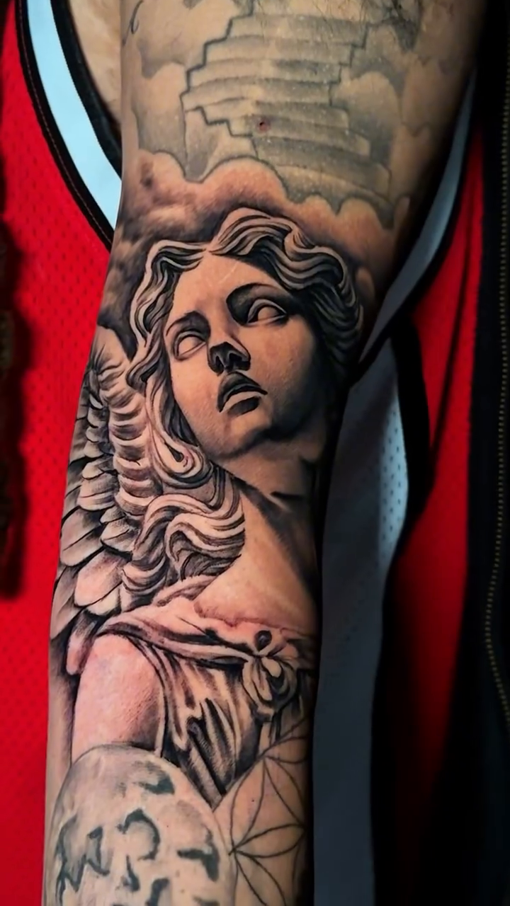 Angel and geometric patterns realism tattoo by Brayan Molina